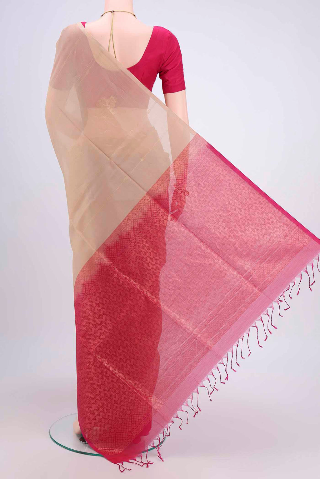 Flat view of Beige Kora Cotton Saree with Zari Butta on the body and Zari Border. 