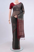 Grey Kora Cotton Saree with Zari Butta on the body and Zari Border.  displayed on a mannequin