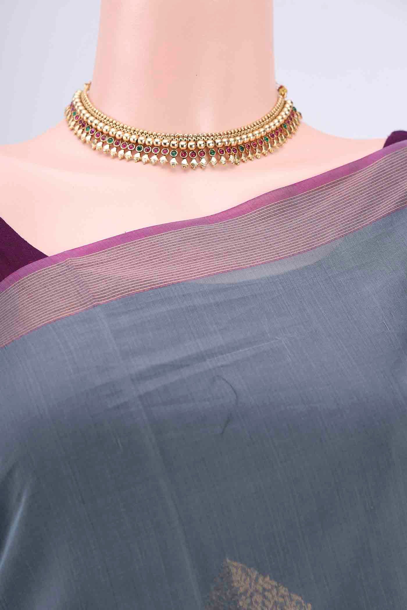 Border image of Grey Kora Cotton Saree with Zari Butta on the body and Zari Border. 