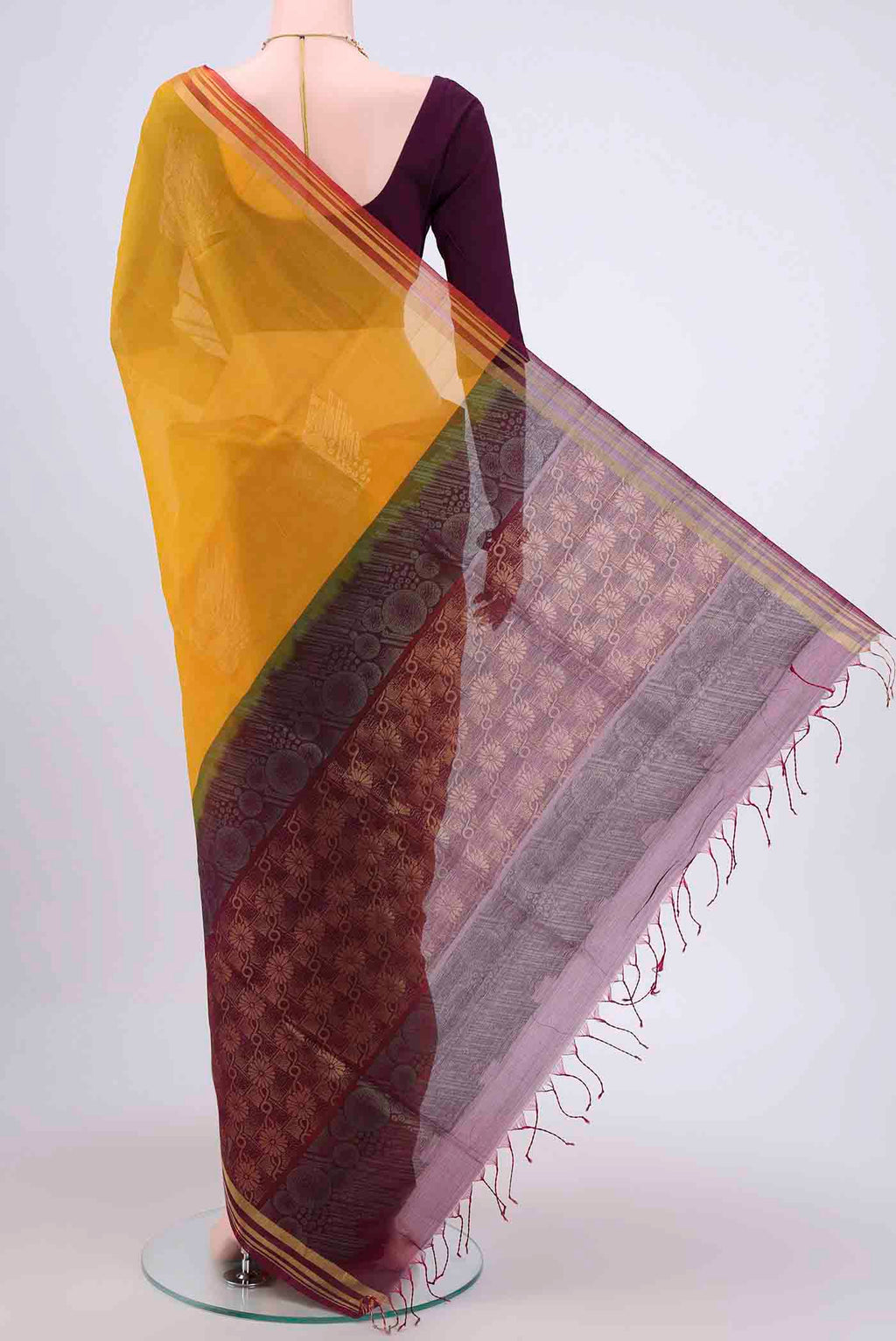 Flat view of Yellow Kora Cotton Saree with Zari Butta on the body and Zari Border. 
