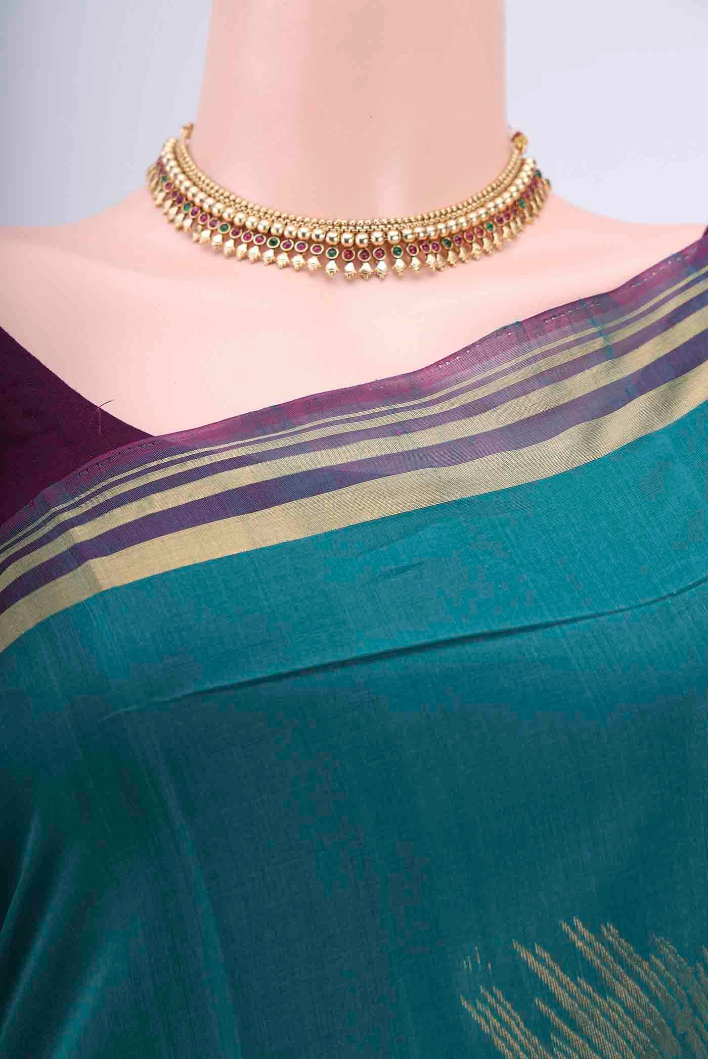 Border image of Sea Green Kora Cotton Saree with Zari Butta on the body and Zari Border. 