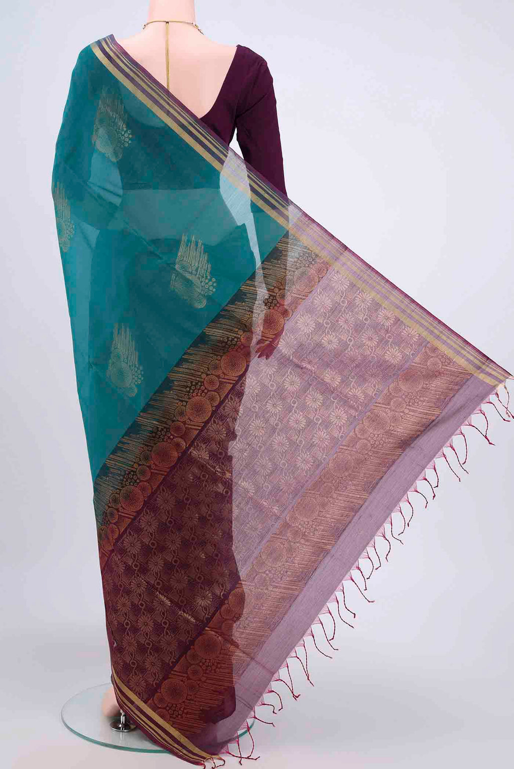 Flat view of Sea Green Kora Cotton Saree with Zari Butta on the body and Zari Border. 