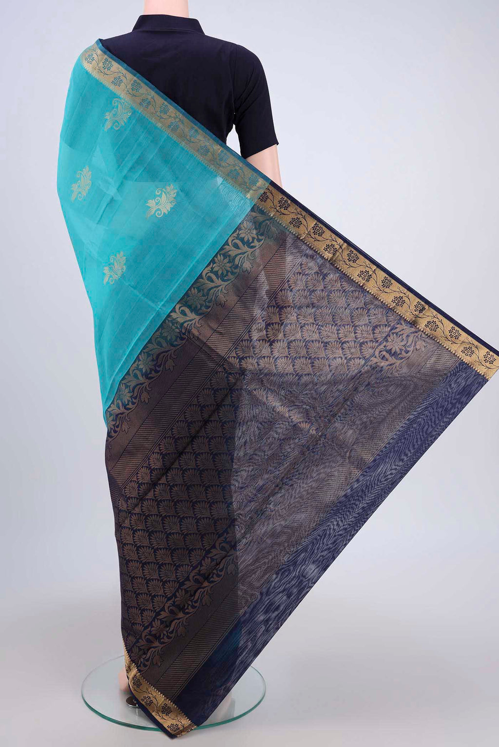 Flat view of Turquoise Silk Cotton Saree with Zari Butta on the body and Zari Border. 