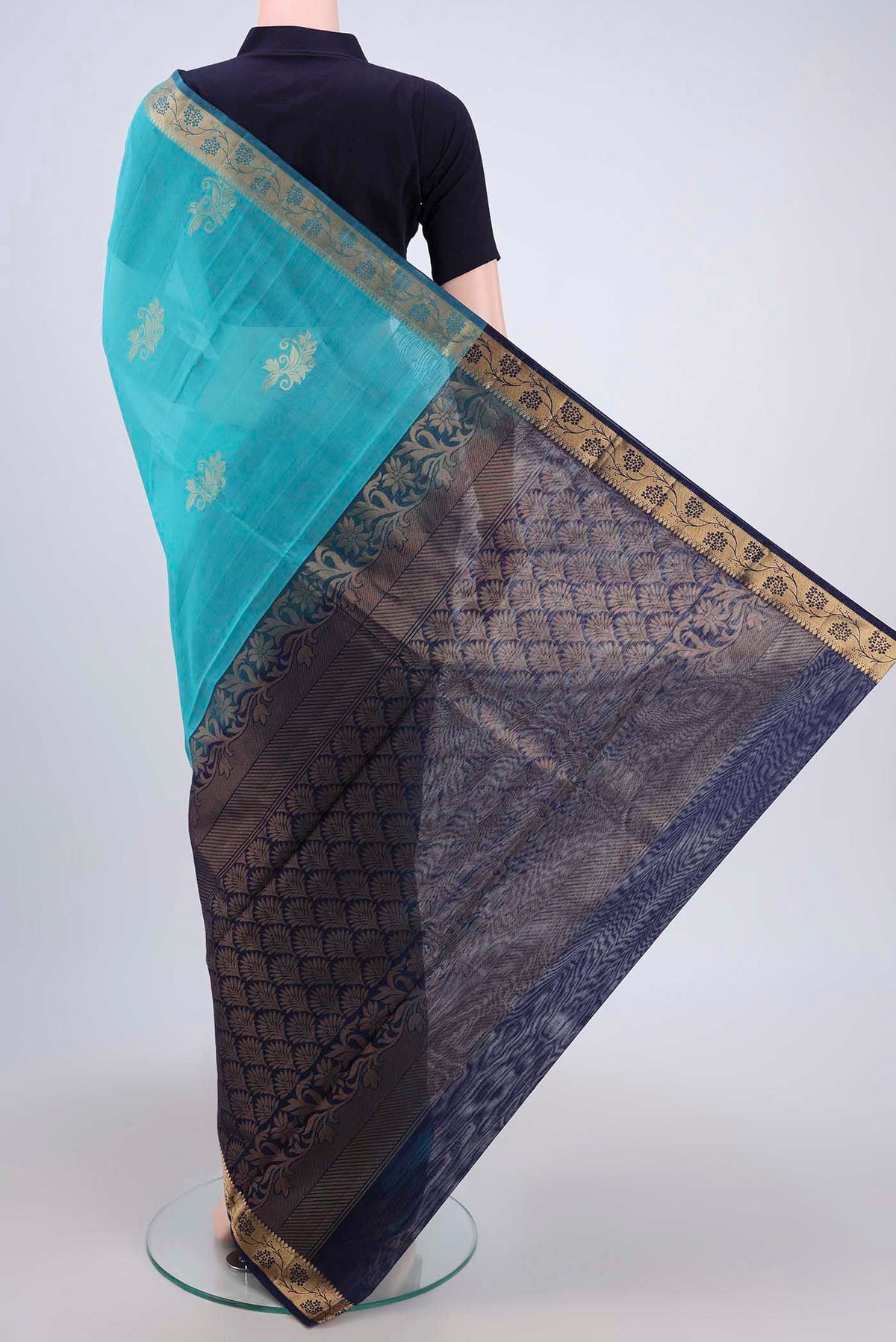 Flat view of Turquoise Silk Cotton Saree with Zari Butta on the body and Zari Border. 
