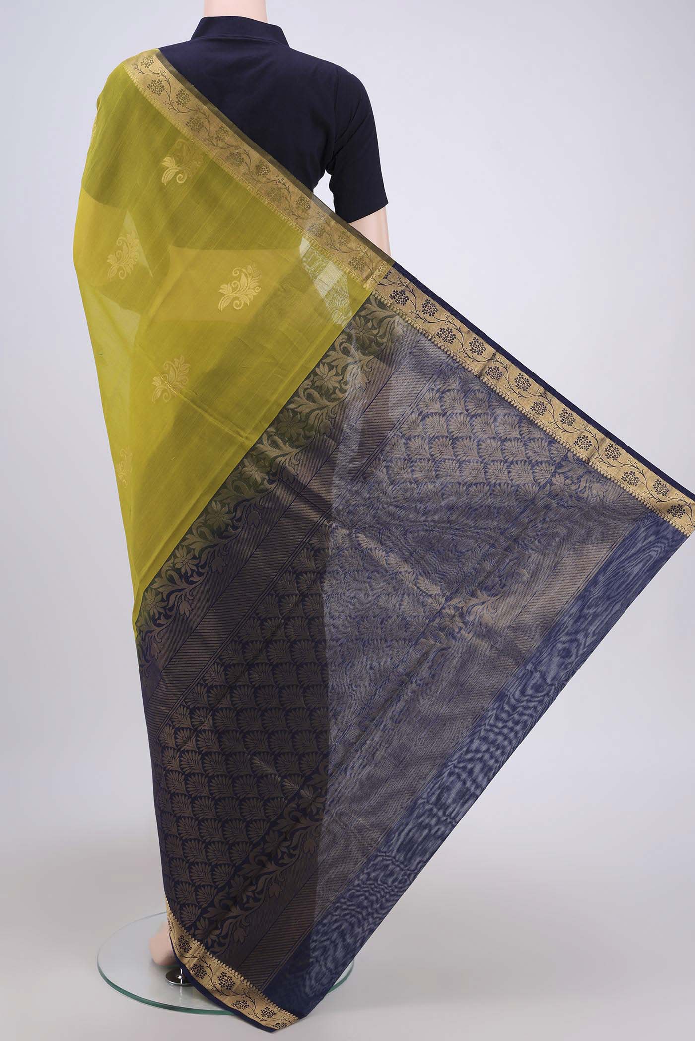 Flat view of Acid Green Silk Cotton Saree with Zari Butta on the body and Zari Border. 