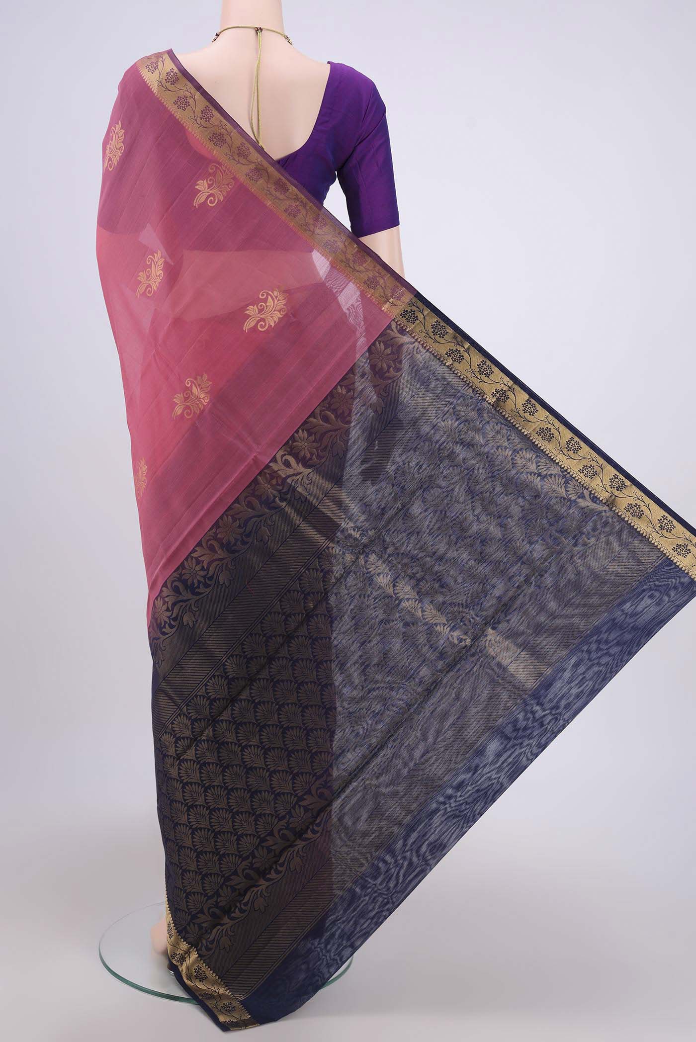 Flat view of Pink Silk Cotton Saree with Zari Butta on the body and Zari Border. 