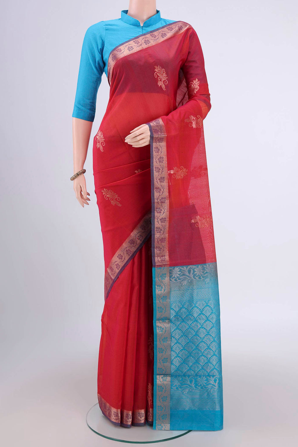 Dark Pink Silk Cotton Saree with Zari Butta on the body and Zari Border.  displayed on a mannequin