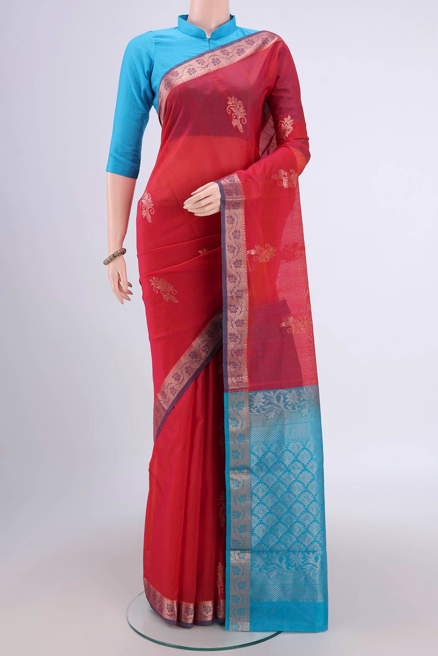 Dark Pink Silk Cotton Saree with Zari Butta on the body and Zari Border.  displayed on a mannequin