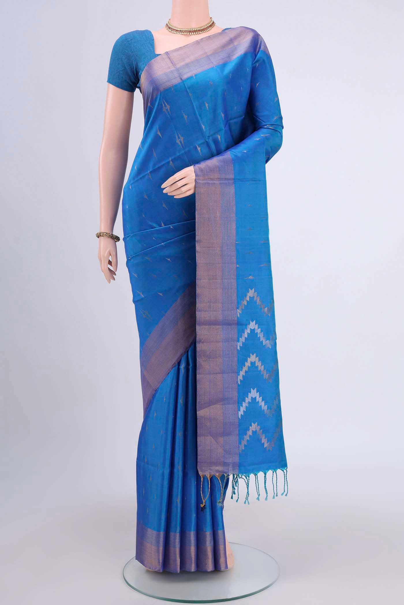 Blue Dual Tone Soft Silk Saree with Zari Butta on the body and Zari Border displayed on a mannequin