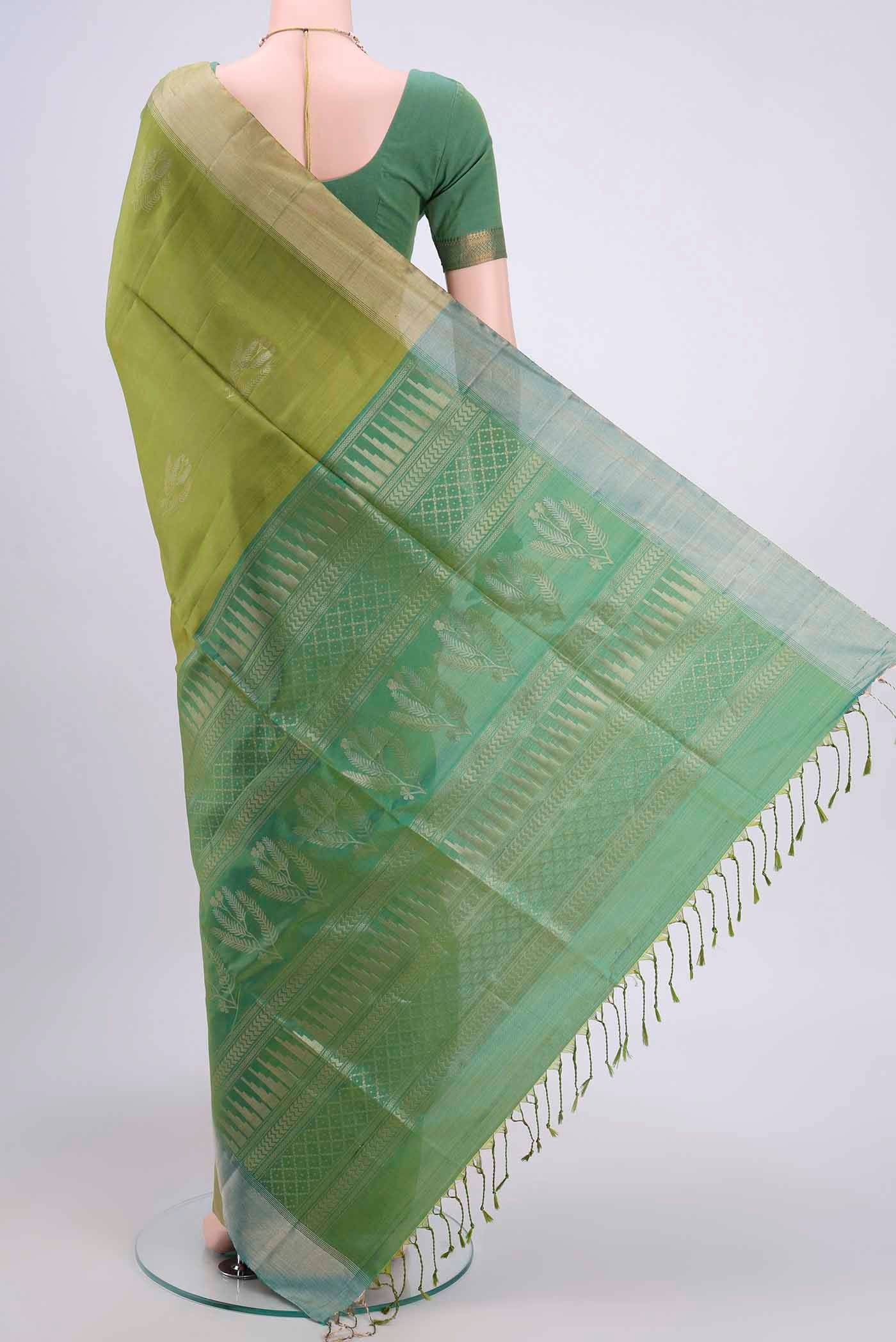 Flat view of Light Green Dual Tone Soft Silk Saree with Zari Butta on the body and Zari Border