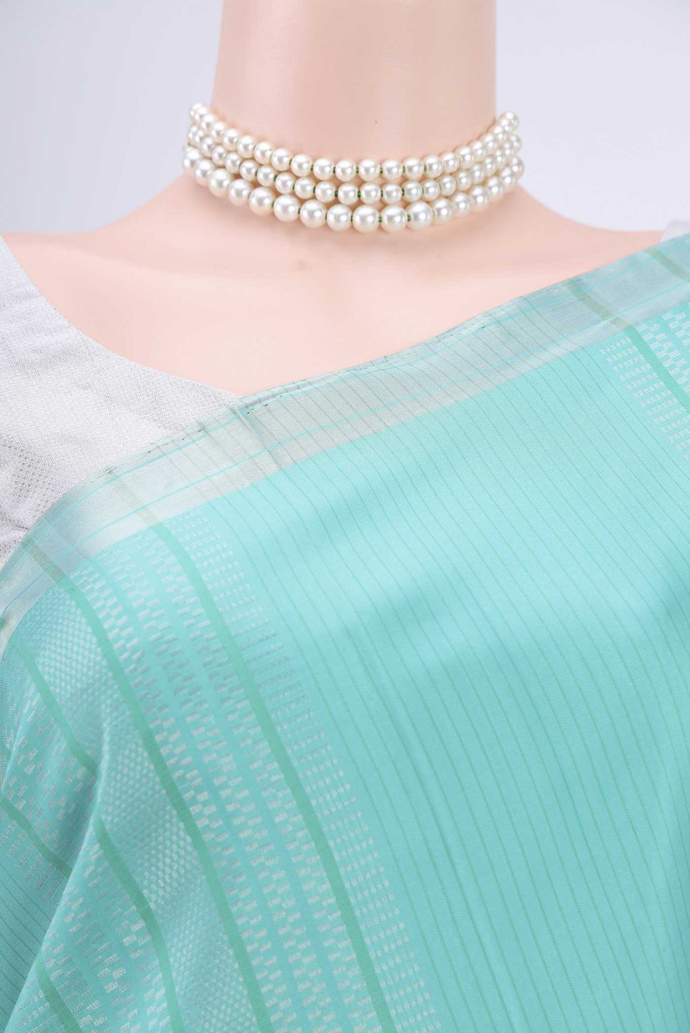 Border image of Sea Green Soft Silk Saree with Stripes on the body and Zari Border. 