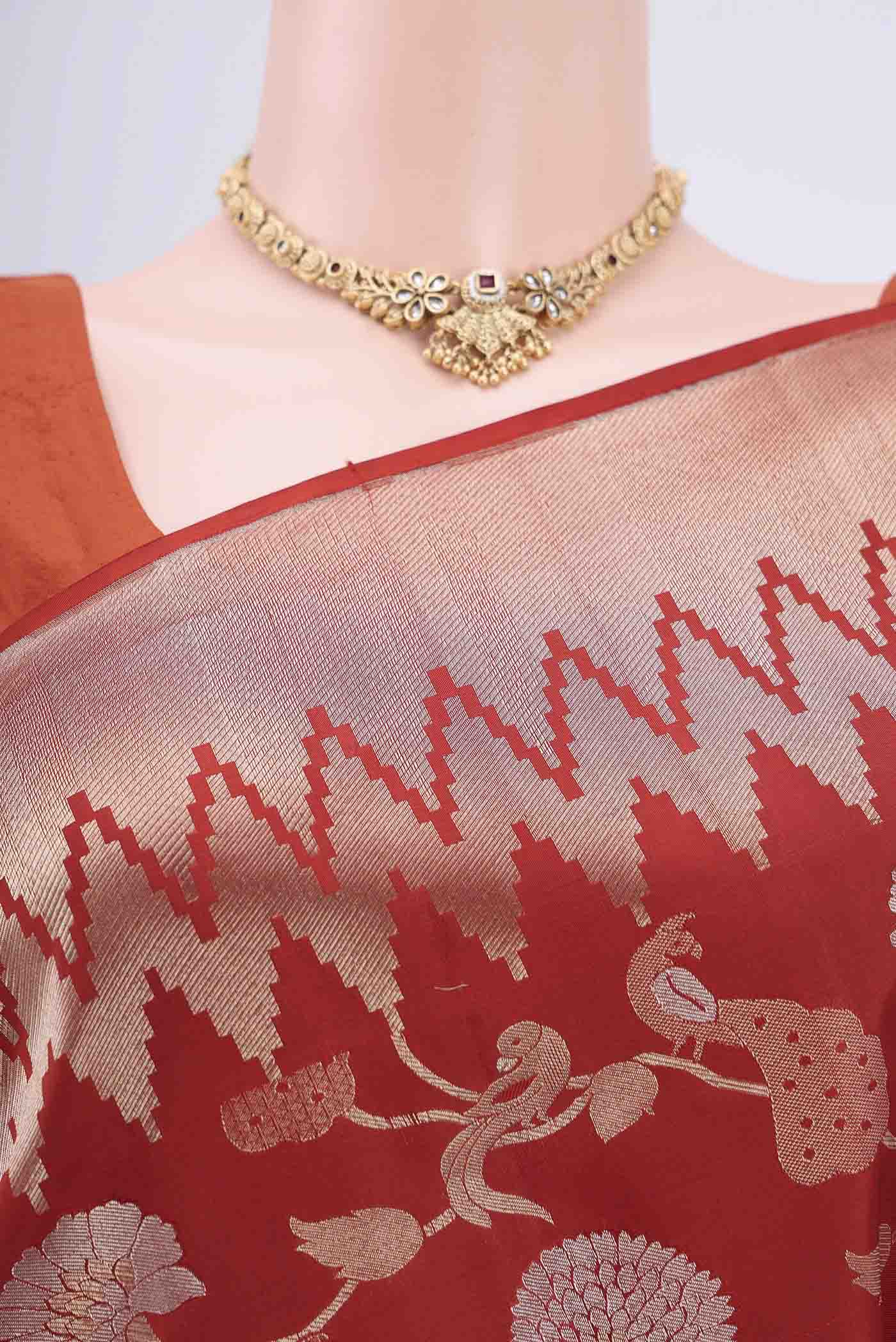 Border image of Rust Soft Silk Saree with Zari Brocade on the body and Zari Border. 