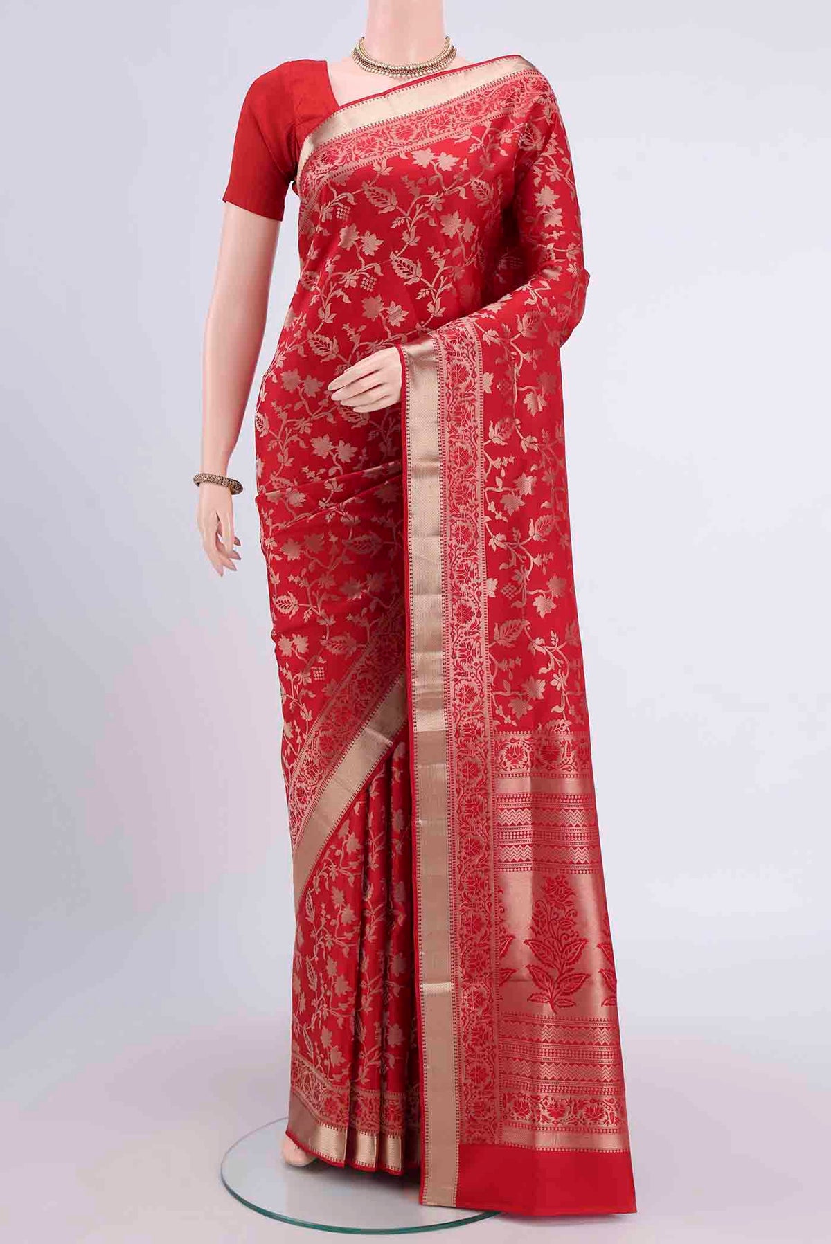 Deep Red Soft Silk Saree with Zari Brocade on the body and Zari Border displayed on a mannequin
