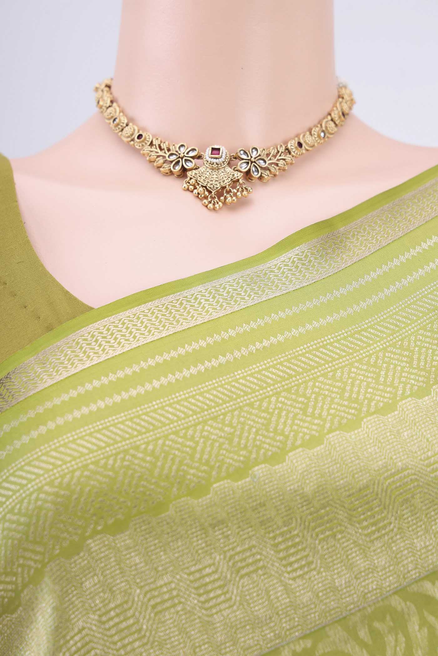 Border image of Light Green Soft Silk Saree with Zari Brocade on the body and Zari Border. 