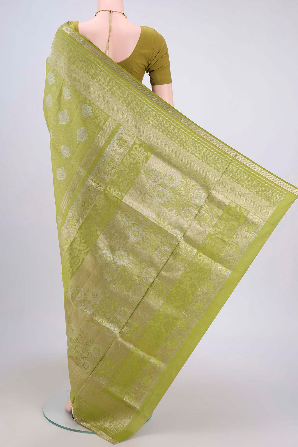 Flat view of Light Green Soft Silk Saree with Zari Brocade on the body and Zari Border. 