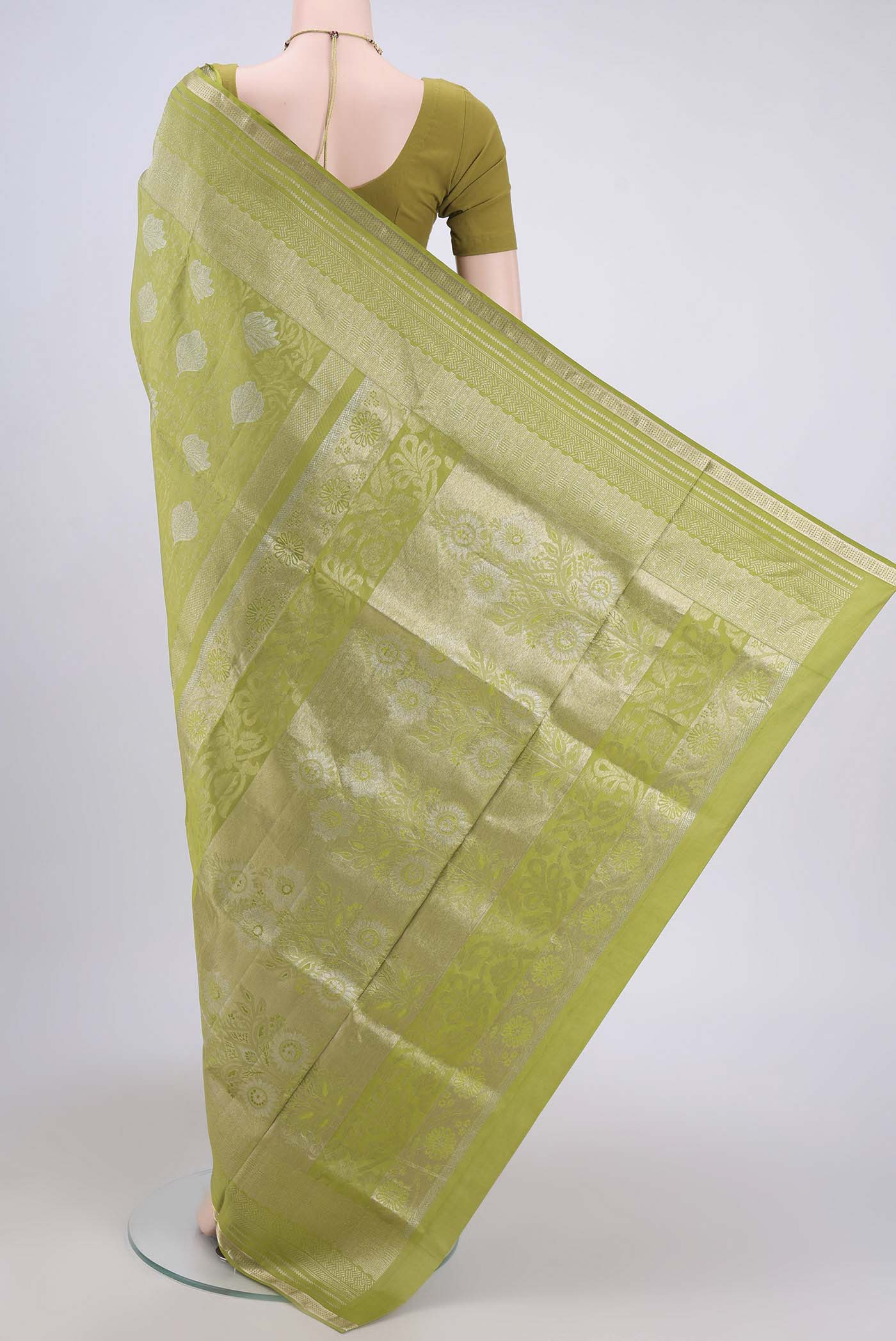 Flat view of Light Green Soft Silk Saree with Zari Brocade on the body and Zari Border. 