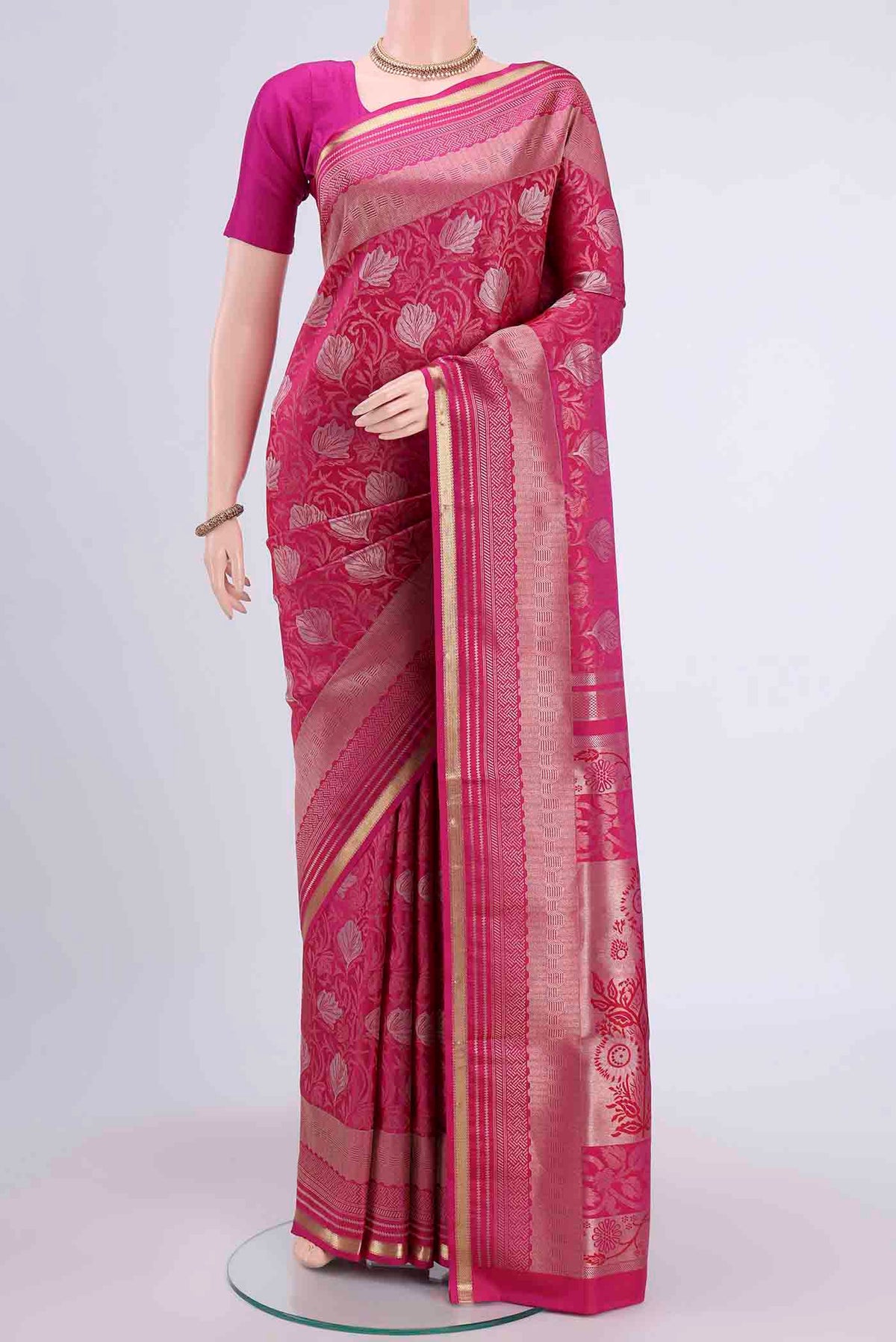 Rani Pink Soft Silk Saree with Zari Brocade on the body and Zari Border displayed on a mannequin
