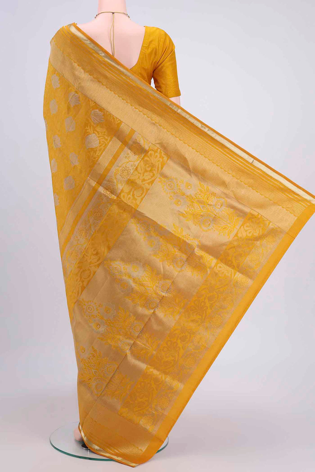 Flat view of Yellow Soft Silk Saree with Zari Brocade on the body and Zari Border