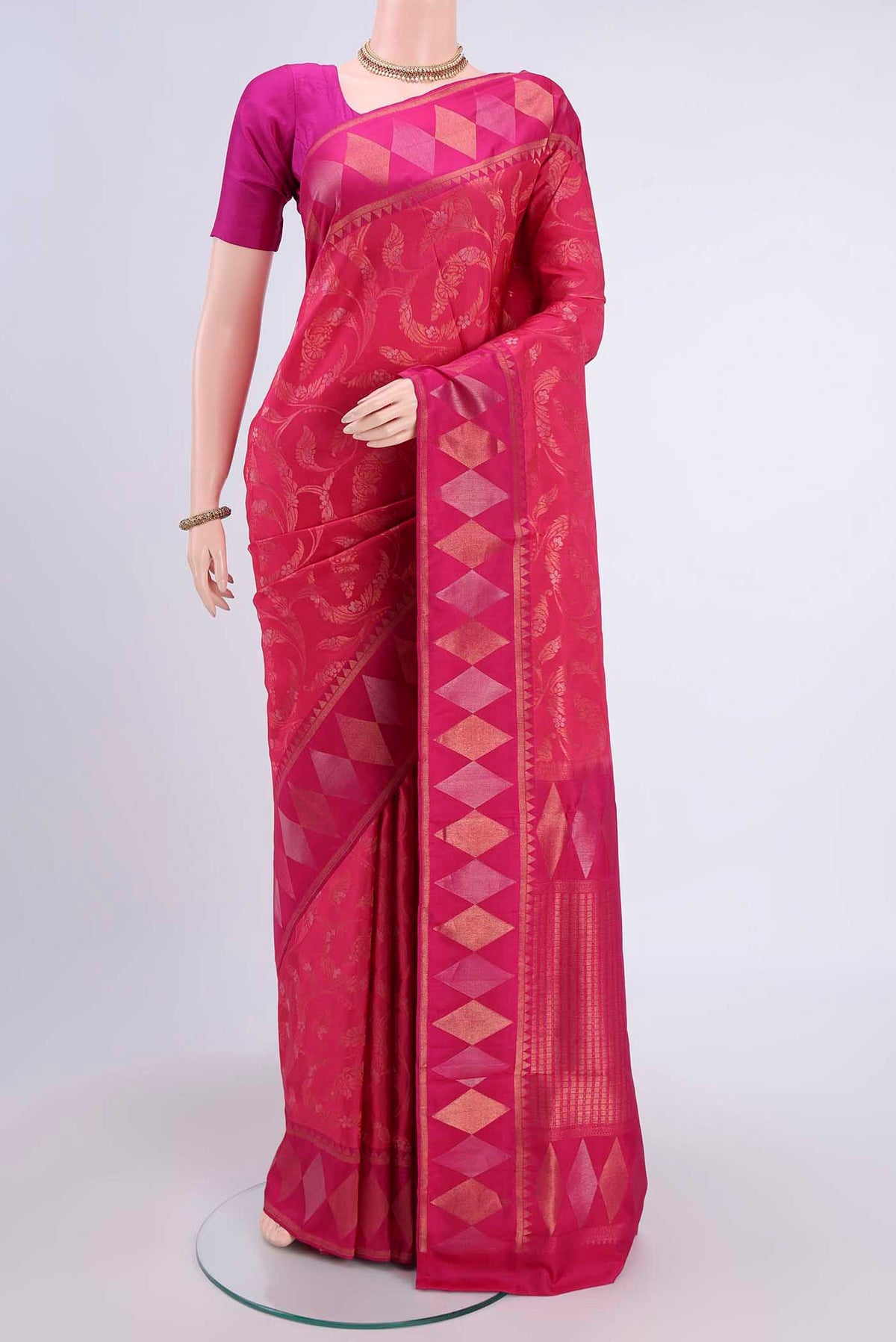 Dark Pink Soft Silk Saree with Zari Brocade on the body and Zari Border displayed on a mannequin