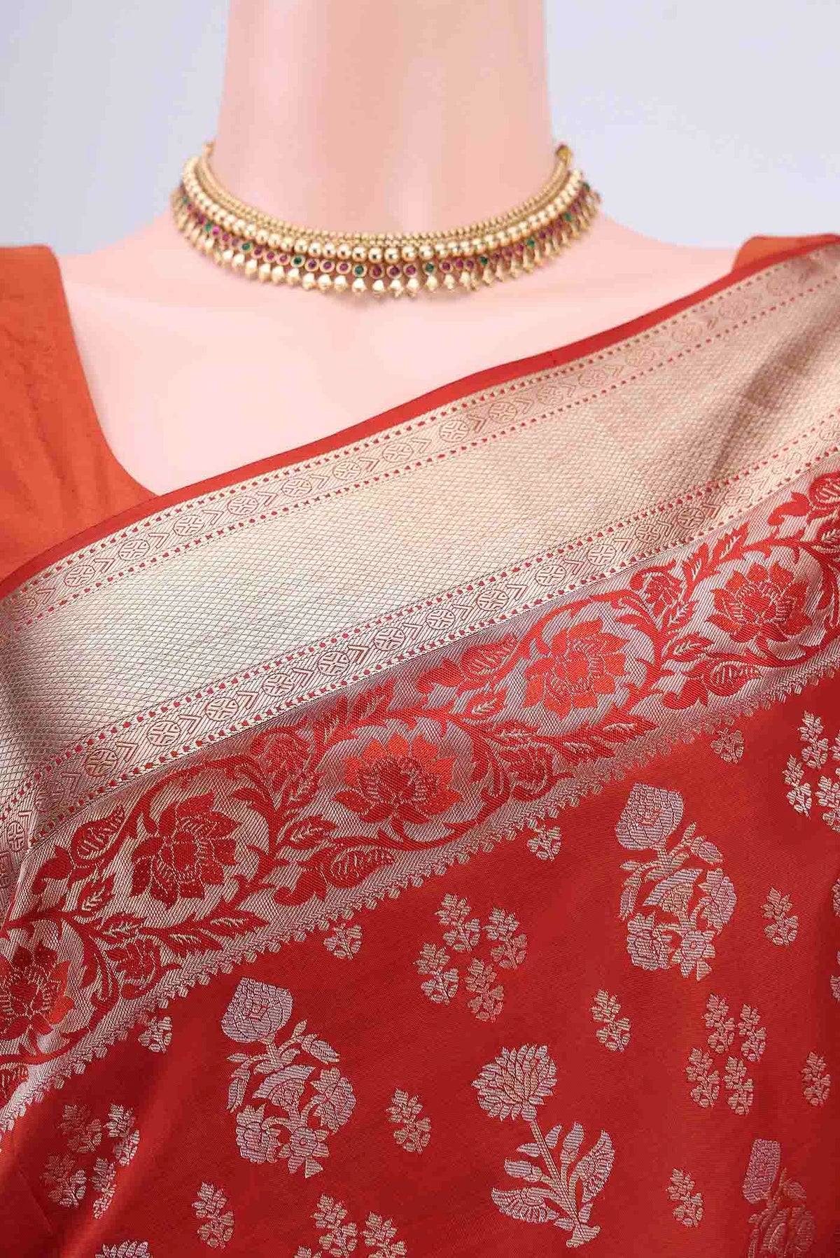 Border image of Rust Soft Silk Saree with Zari Butta on the body and Zari Border
