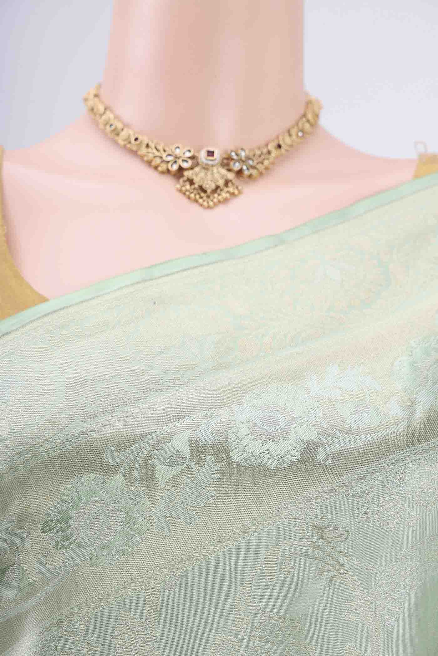 Border image of Mint Green Soft Silk Saree with Zari Brocade on the body and Zari Border. 