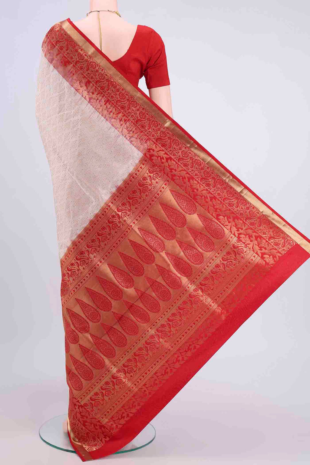 Flat view of Off White Soft Silk Saree with Zari Brocade on the body and Zari Border