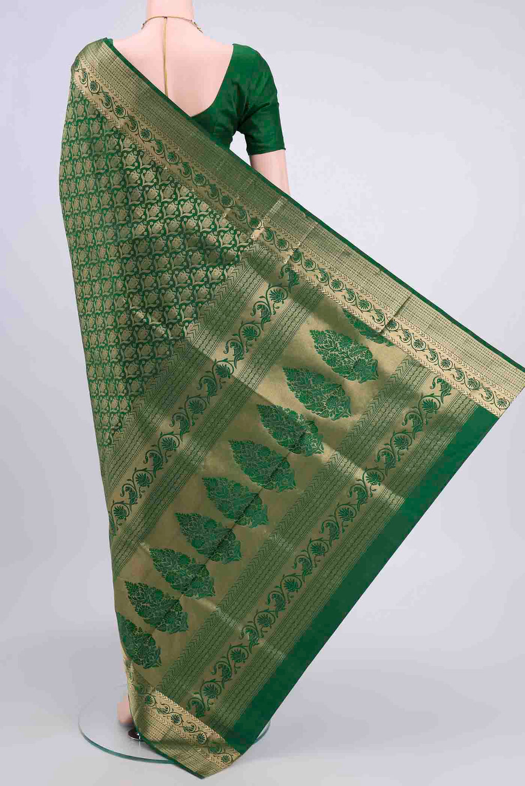 Flat view of Bottle Green Soft Silk Saree with Zari Brocade on the body and Zari Border