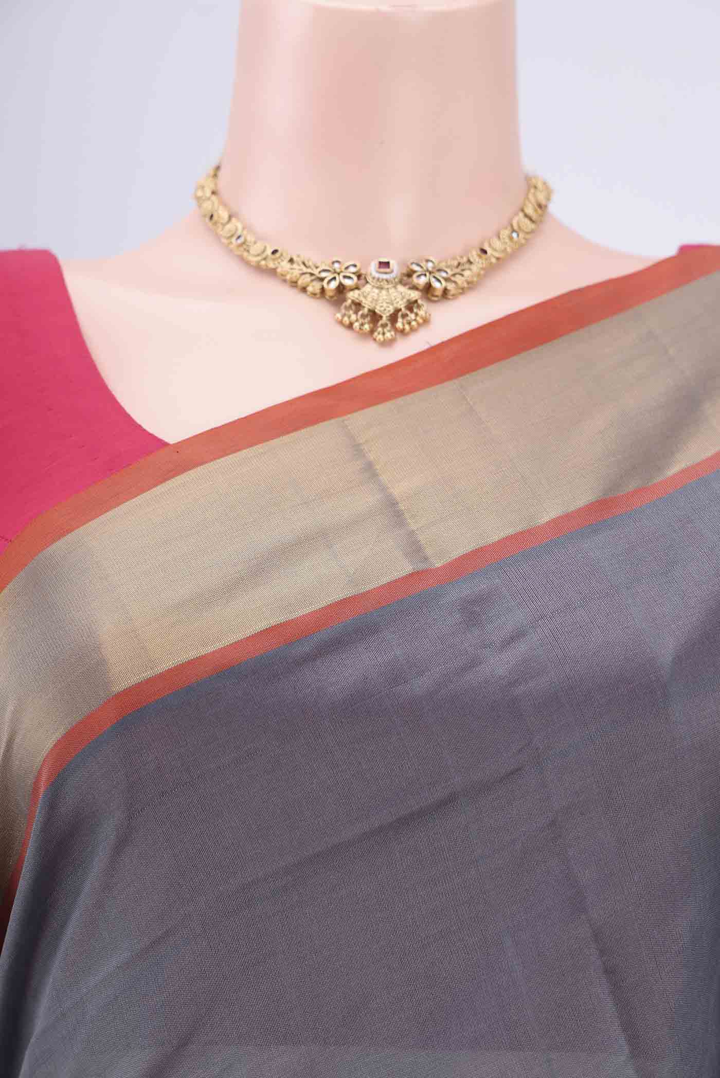 Border image of Grey Blended Poly Cotton Saree with Thread Butta on the body and Zari Border. 