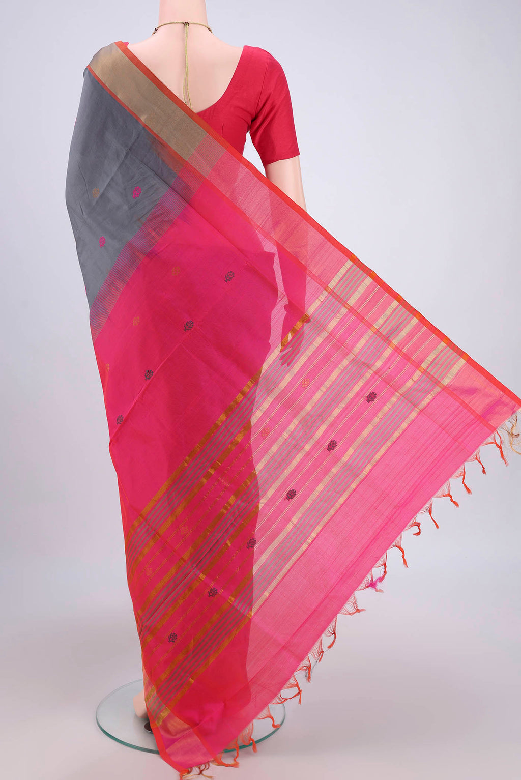 Flat view of Grey Blended Poly Cotton Saree with Thread Butta on the body and Zari Border. 
