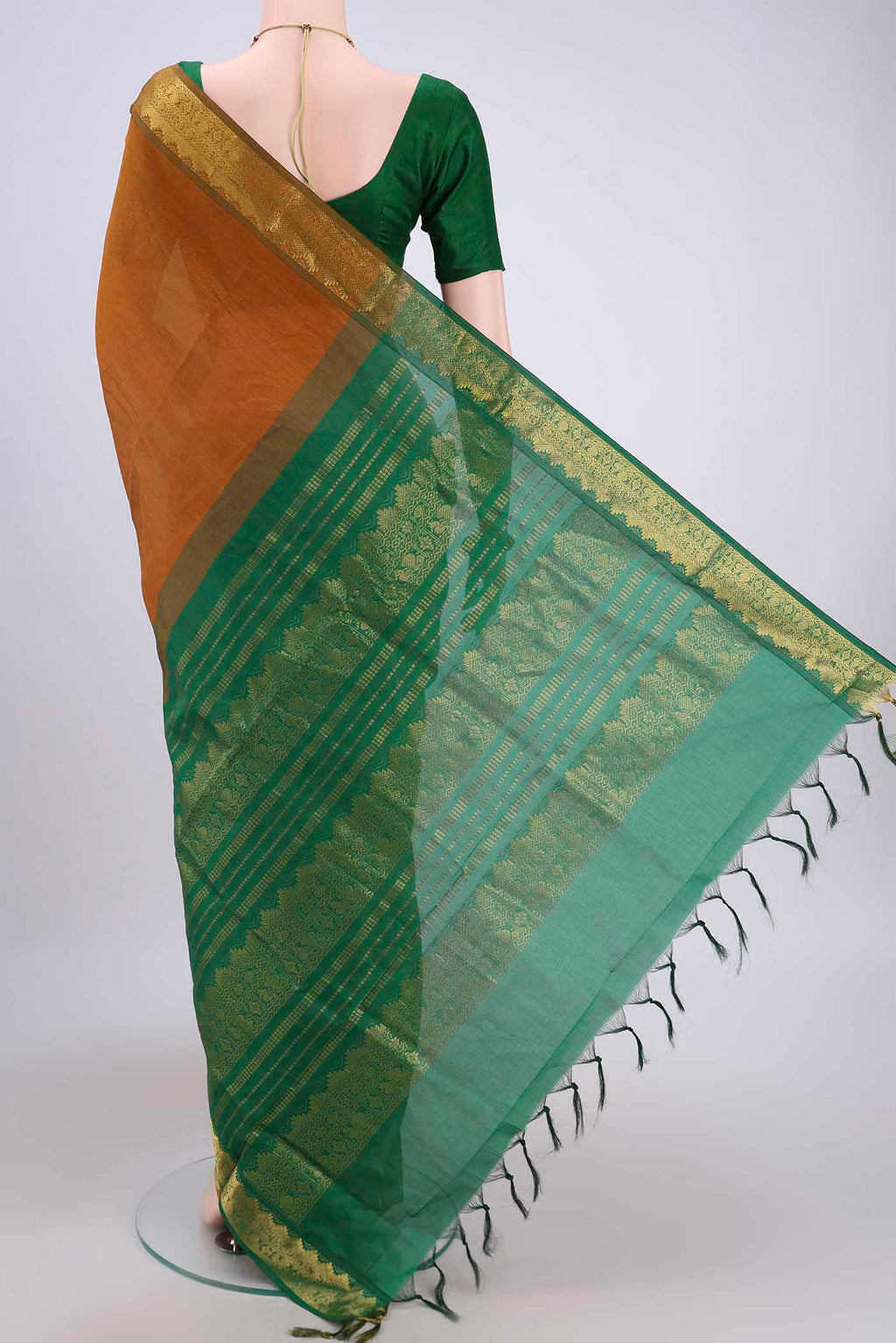 Flat view of Mustard Blended Poly Cotton Saree with Plain Body and Zari Border. 