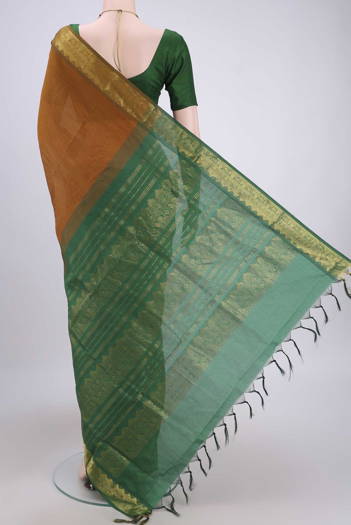 Flat view of Mustard Blended Poly Cotton Saree with Plain Body and Zari Border. 