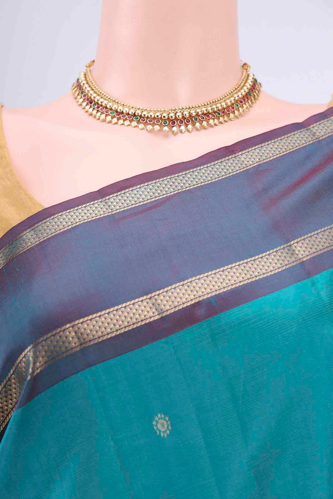 Border image of Blue Kanchipuram Silk Saree with Zari Butta on the body and Zari Border