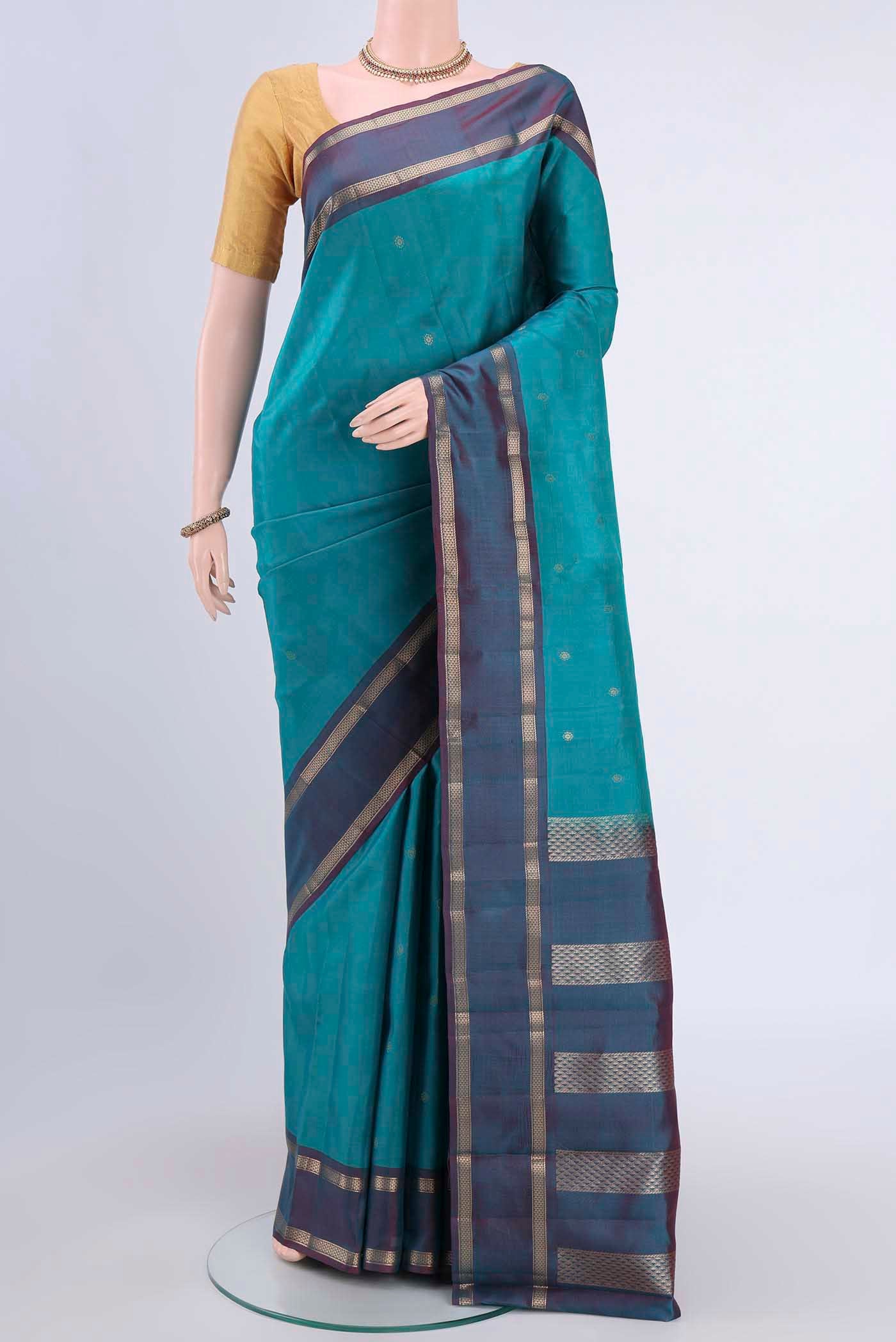 Blue Kanchipuram Silk Saree with Zari Butta on the body and Zari Border displayed on a mannequin