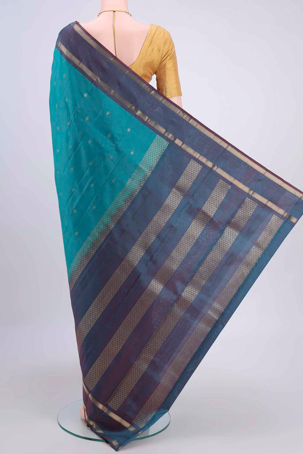 Flat view of Blue Kanchipuram Silk Saree with Zari Butta on the body and Zari Border