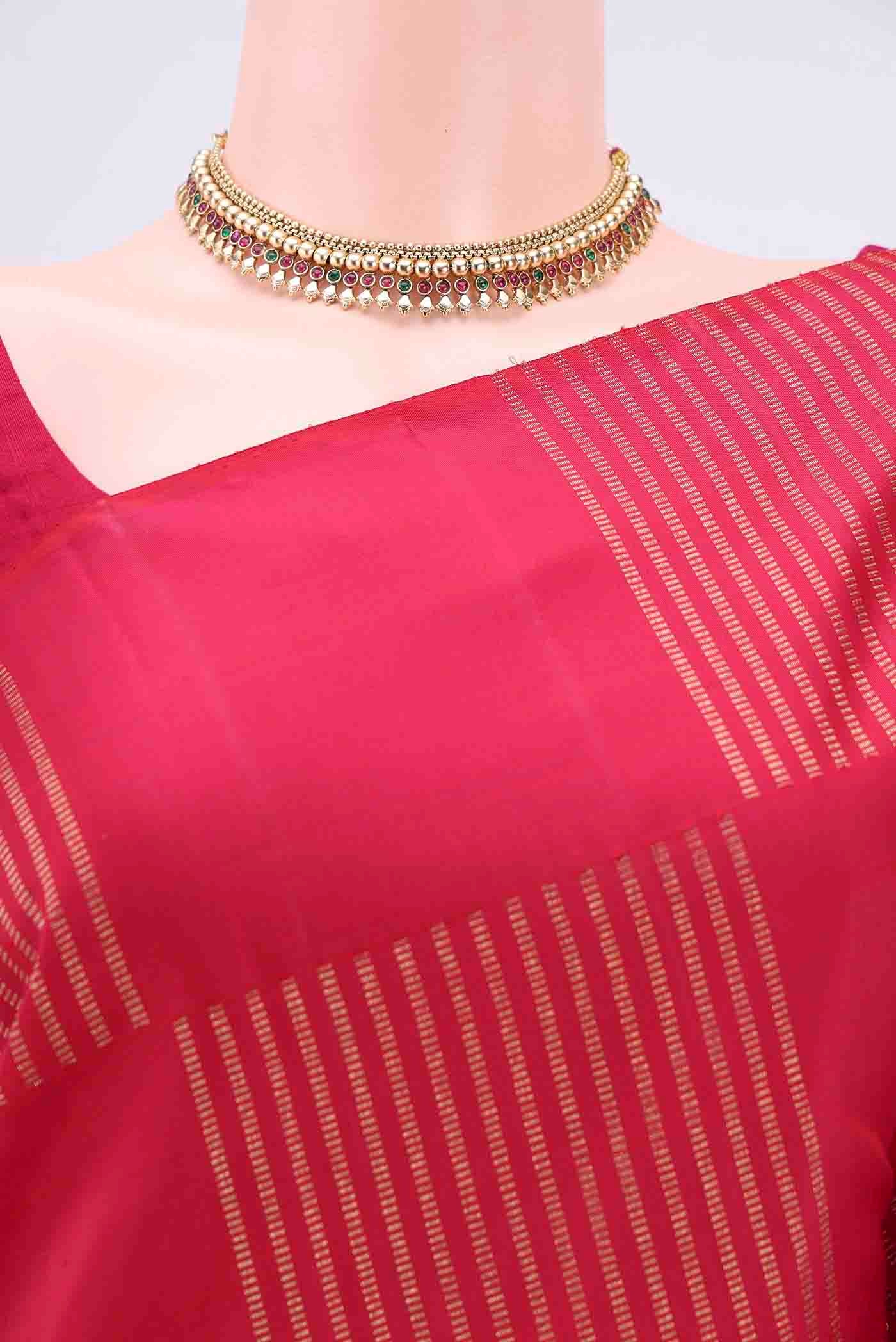 Border image of Dark Pink Kanchipuram Silk Saree with Stripes on the body and Zari Border. 