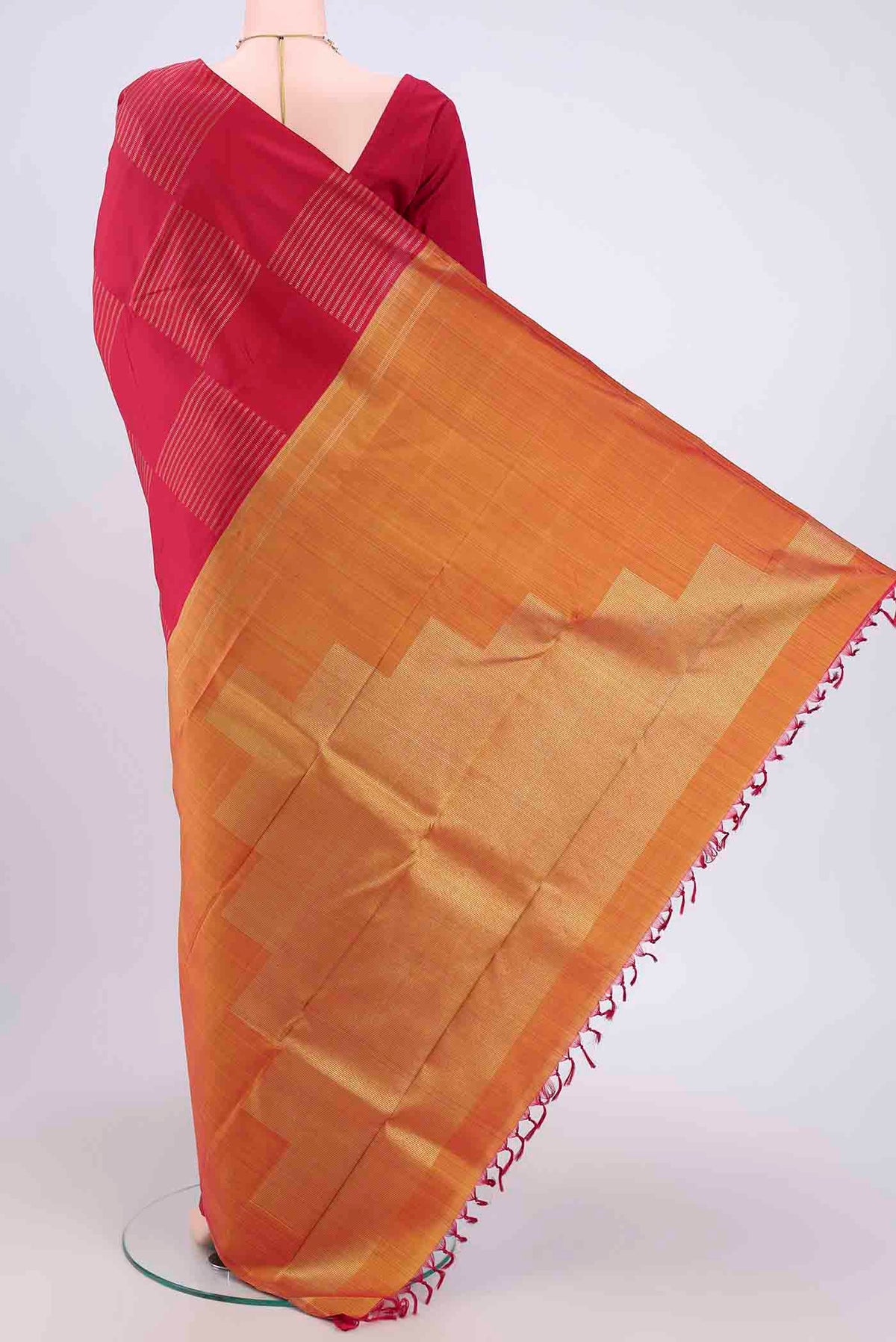 Flat view of Dark Pink Kanchipuram Silk Saree with Stripes on the body and Zari Border. 