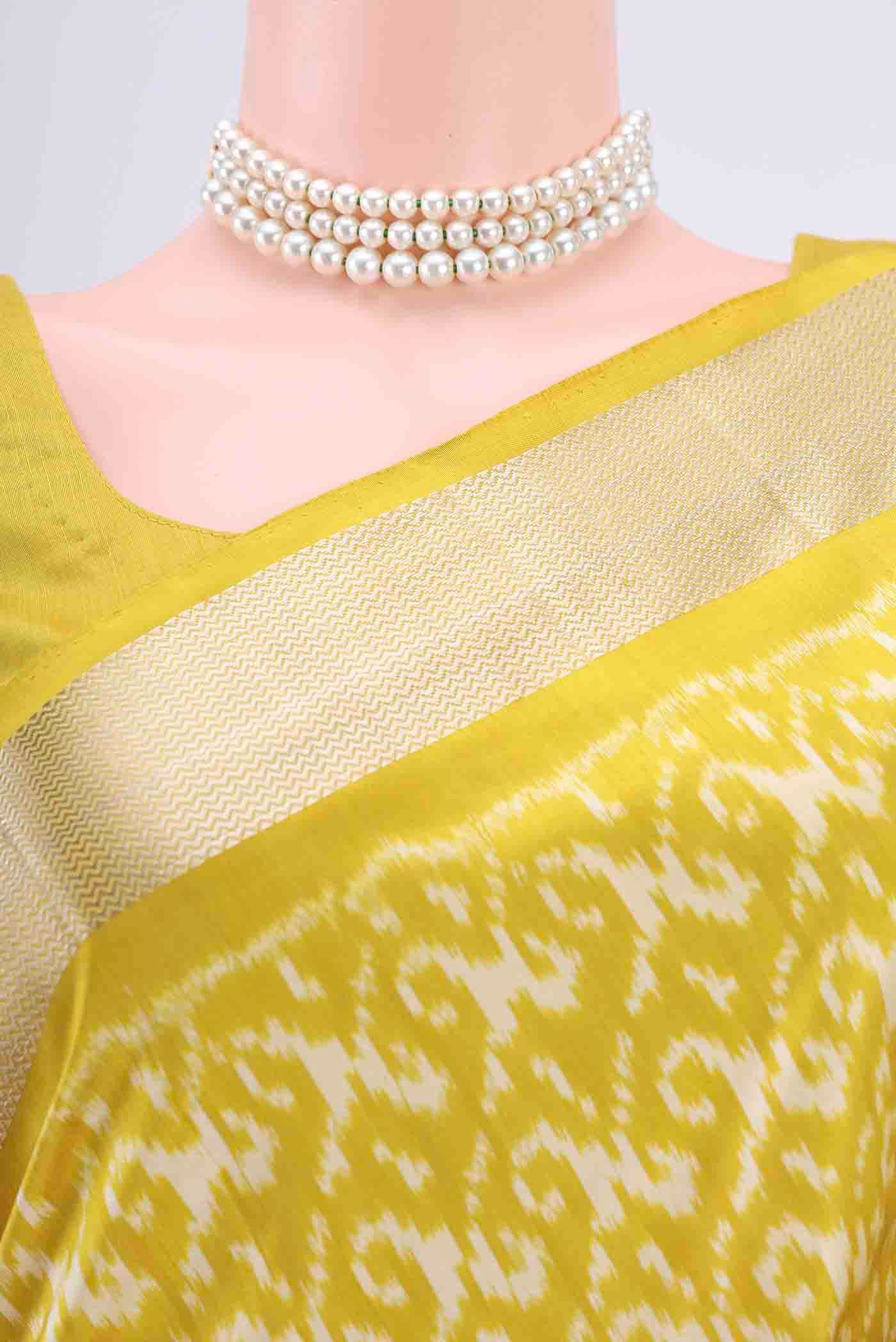 Border image of Yellow Pochampally Silk Saree with Pure Ikat on the body and Zari Border