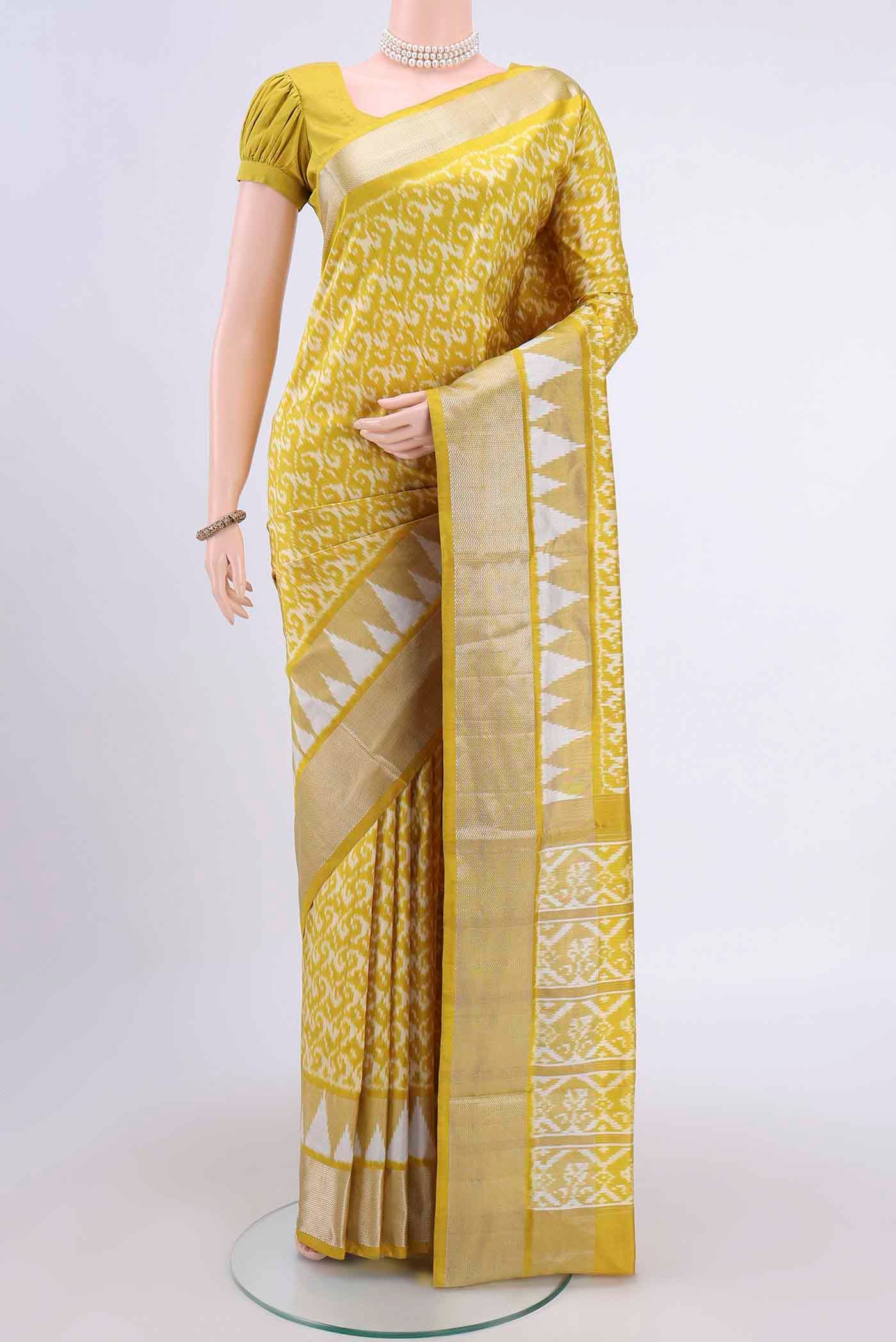 Yellow Pochampally Silk Saree with Pure Ikat on the body and Zari Border displayed on a mannequin