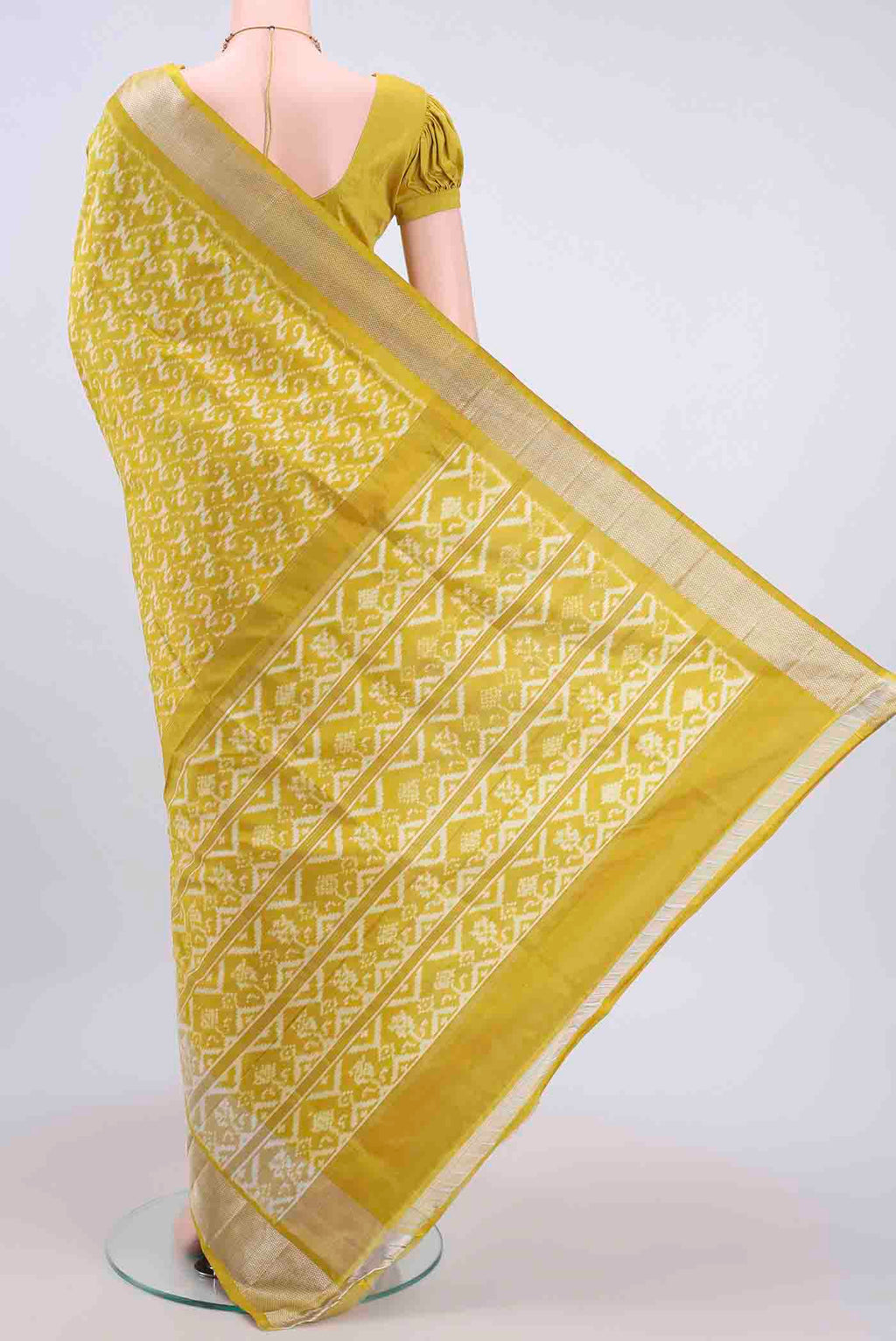 Flat view of Yellow Pochampally Silk Saree with Pure Ikat on the body and Zari Border