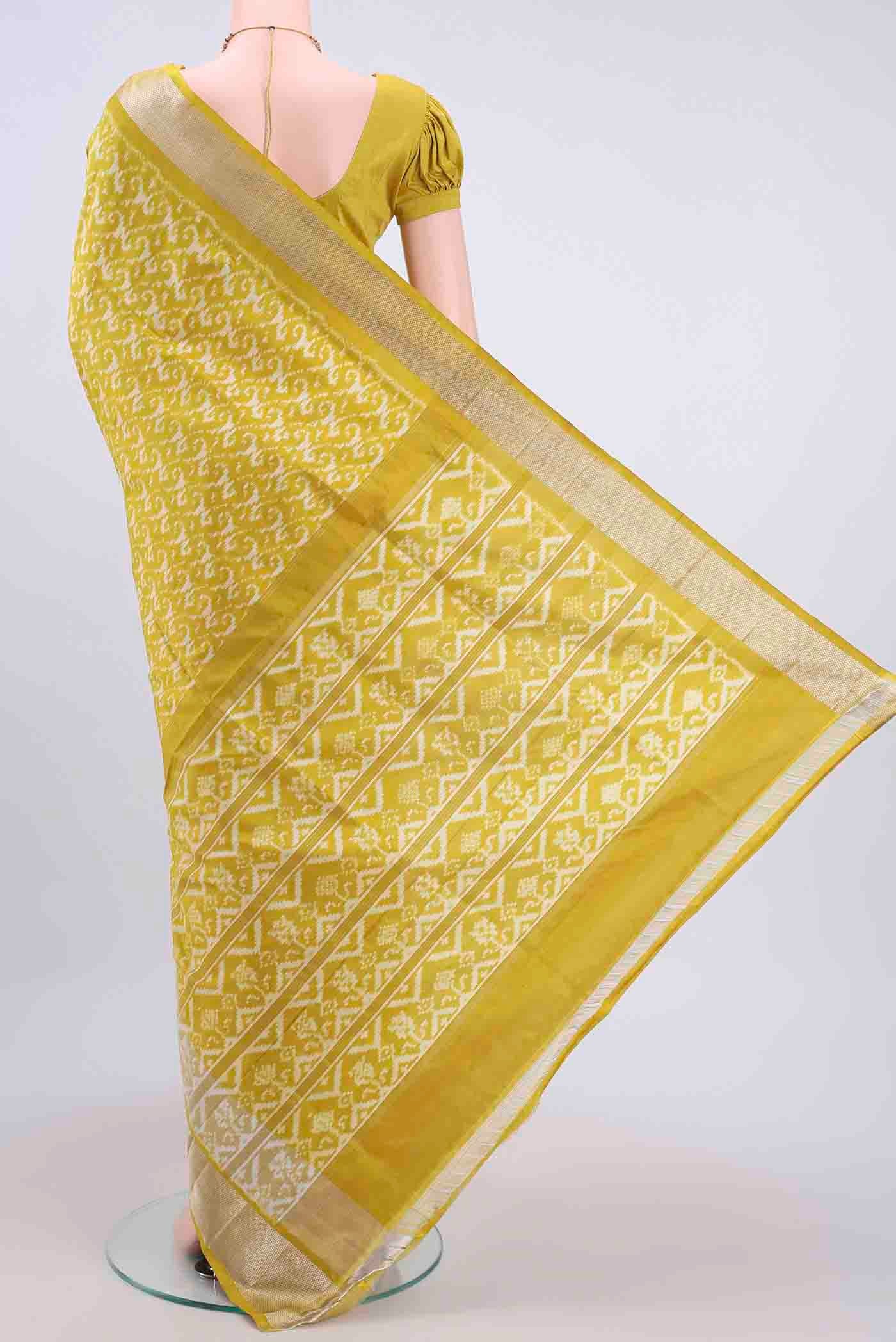 Flat view of Yellow Pochampally Silk Saree with Pure Ikat on the body and Zari Border