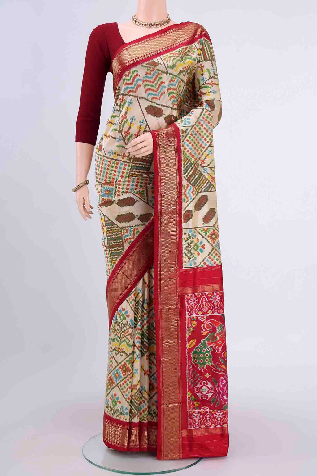 Cream Pochampally Silk Saree with Pure Ikat on the body and Zari Border displayed on a mannequin