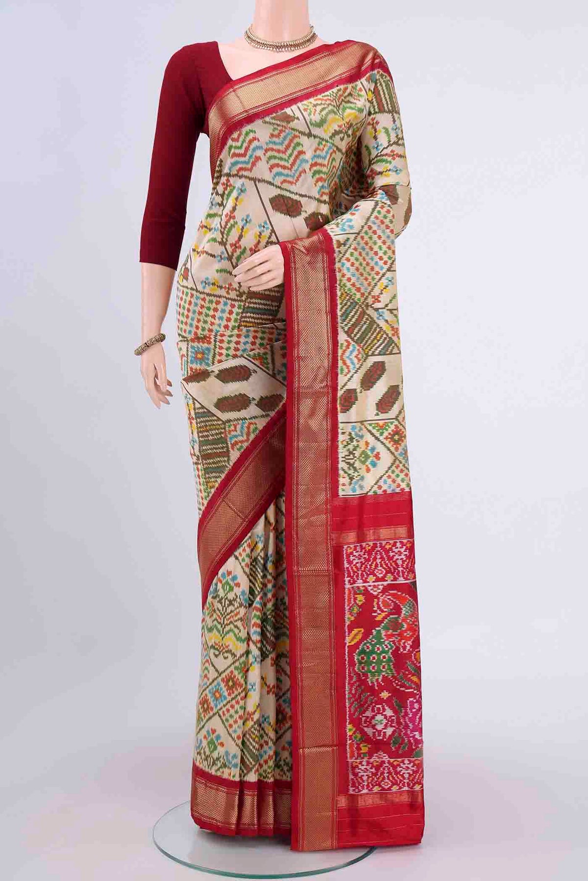 Cream Pochampally Silk Saree with Pure Ikat on the body and Zari Border displayed on a mannequin