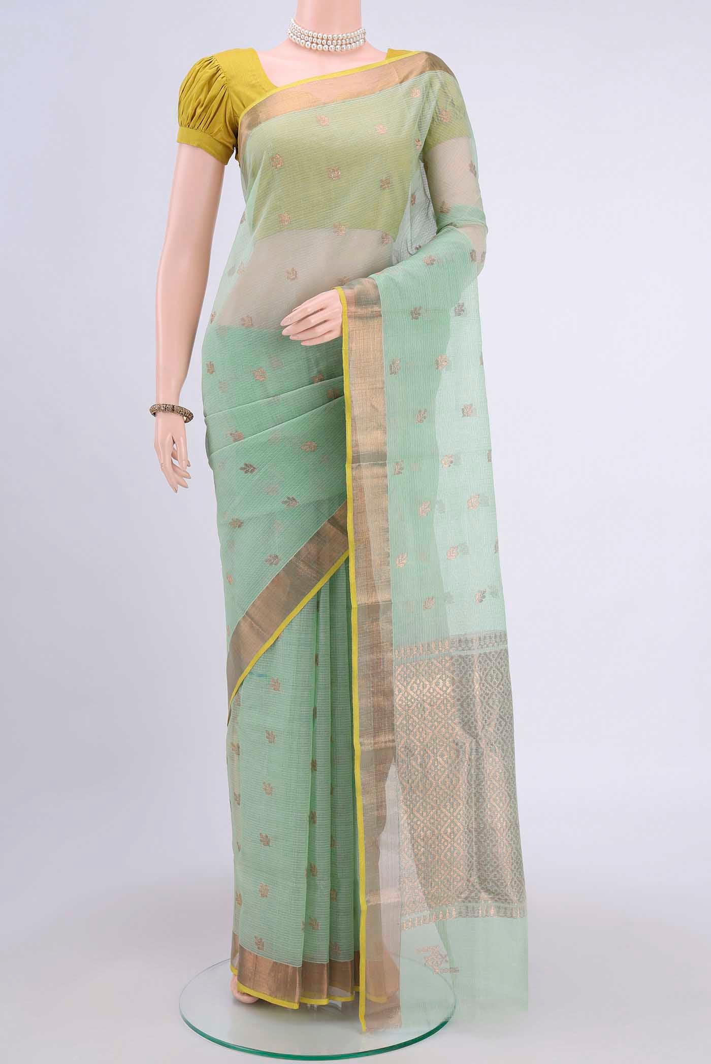 Pure Silk Pure Zari Mint Green Kota Saree with Zari Butta on the body and Zari Border displayed on a mannequin
