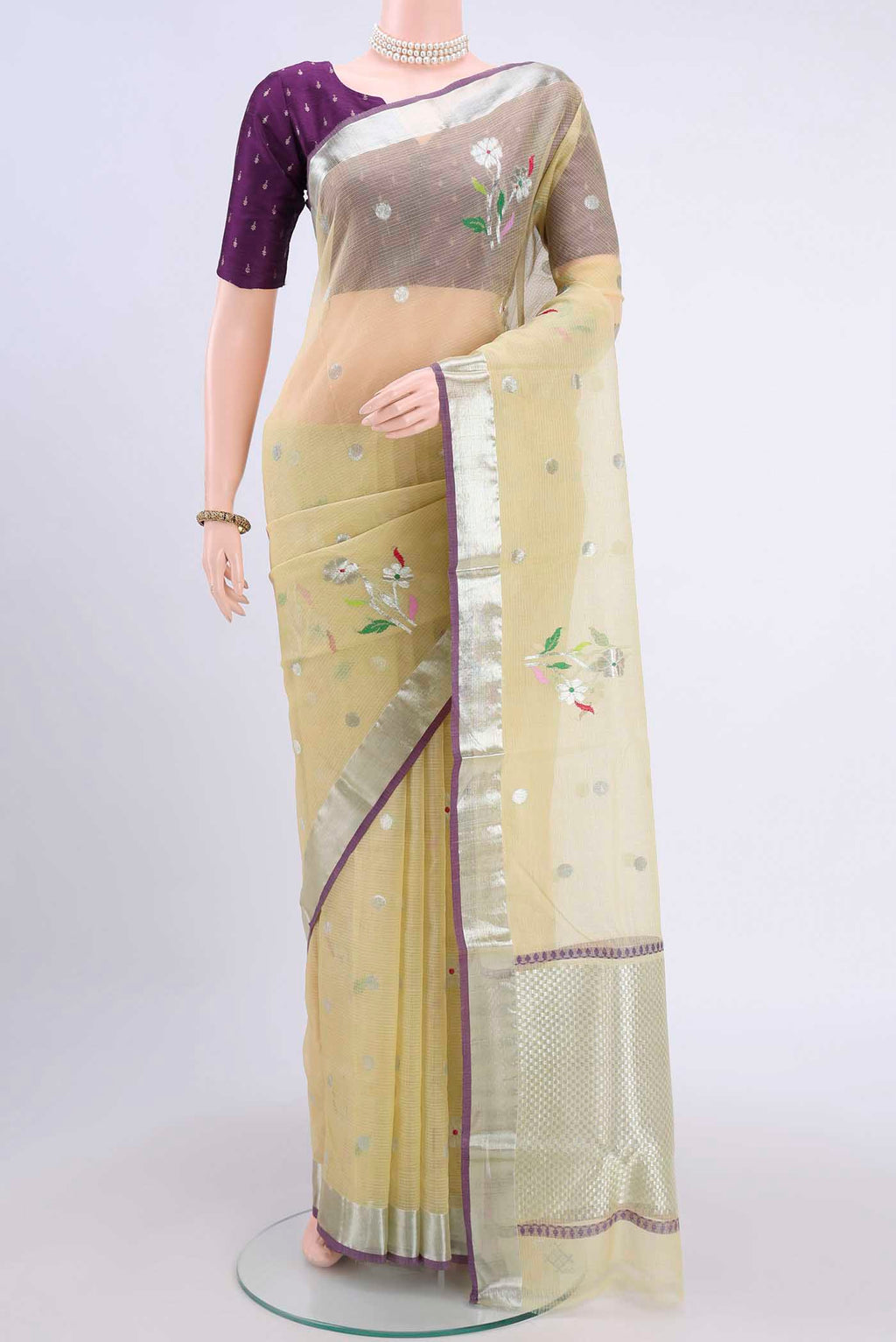Pure Silk Pure Zari Lemon Yellow Kota Saree with Zari Butta on the body and Zari Border displayed on a mannequin