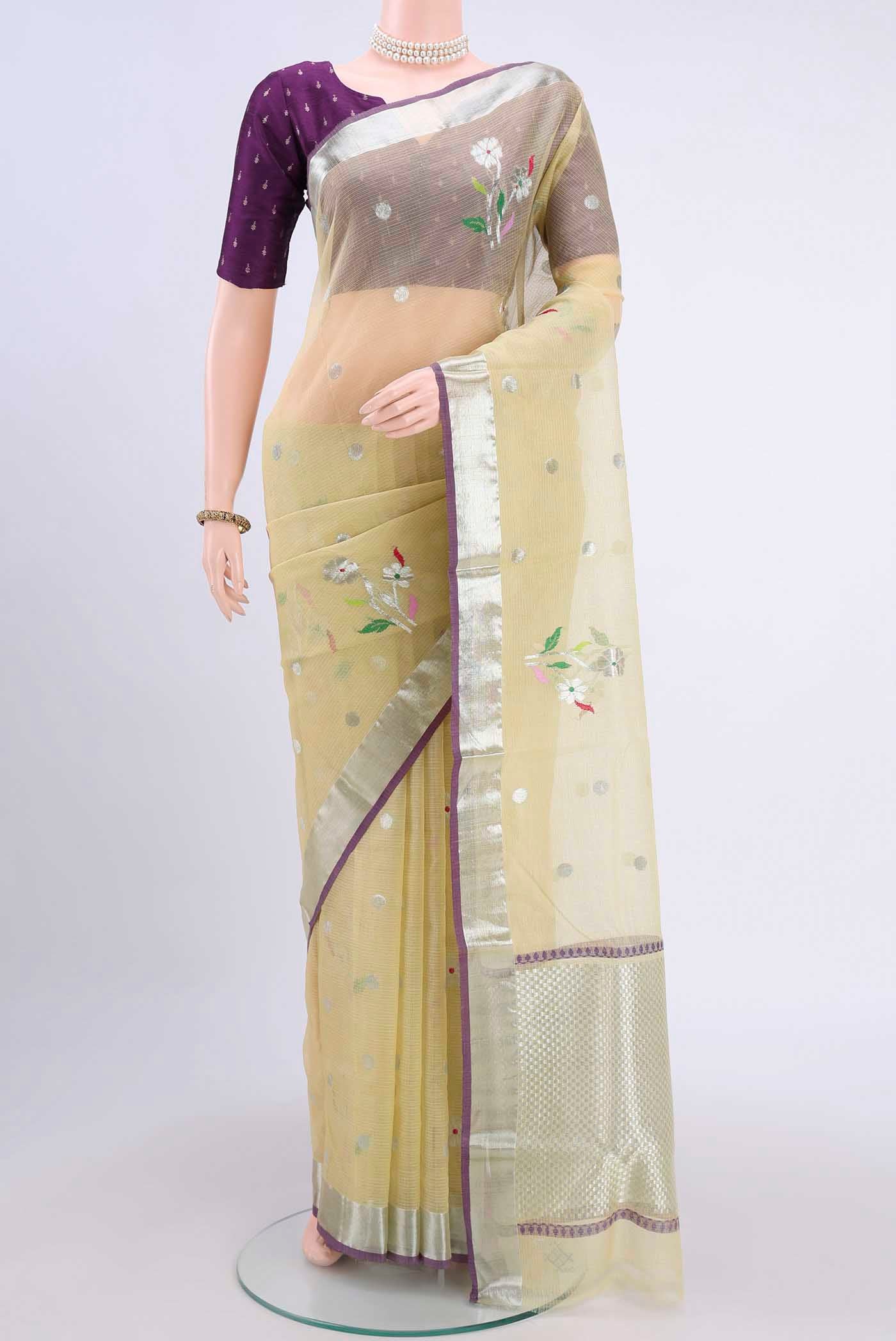 Pure Silk Pure Zari Lemon Yellow Kota Saree with Zari Butta on the body and Zari Border displayed on a mannequin