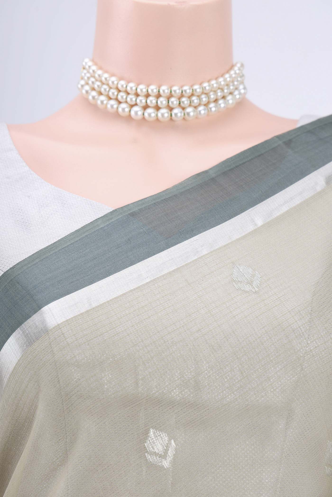 Border image of Pure Silk Pure Zari Sage Green Kota Cotton Saree with Zari And Thread Butta on the body and Zari Border. 