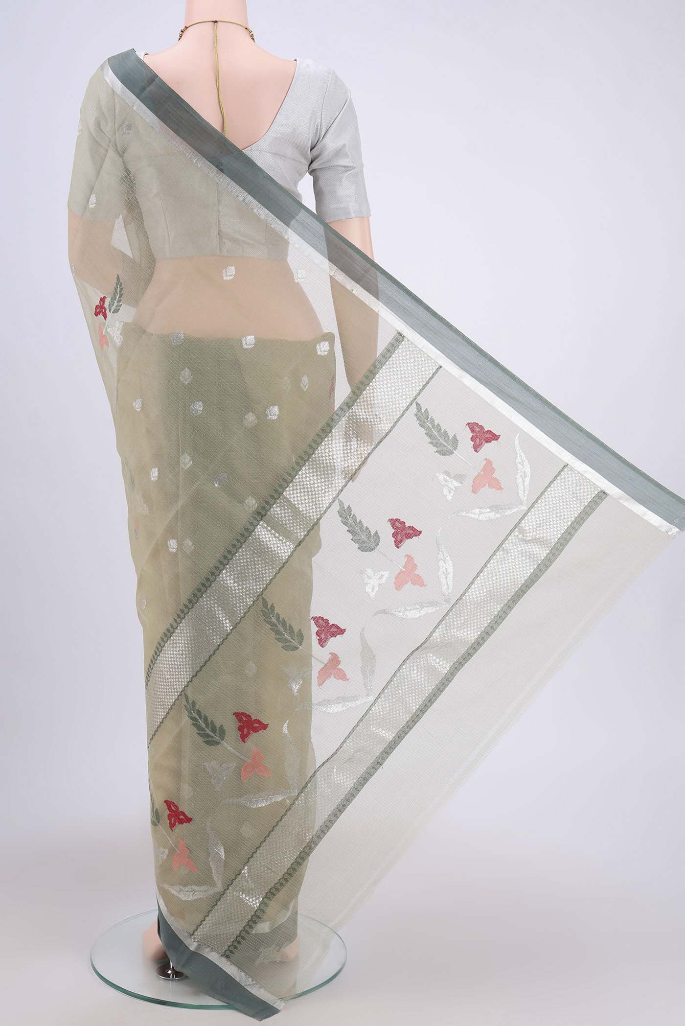 Flat view of Pure Silk Pure Zari Sage Green Kota Cotton Saree with Zari And Thread Butta on the body and Zari Border. 