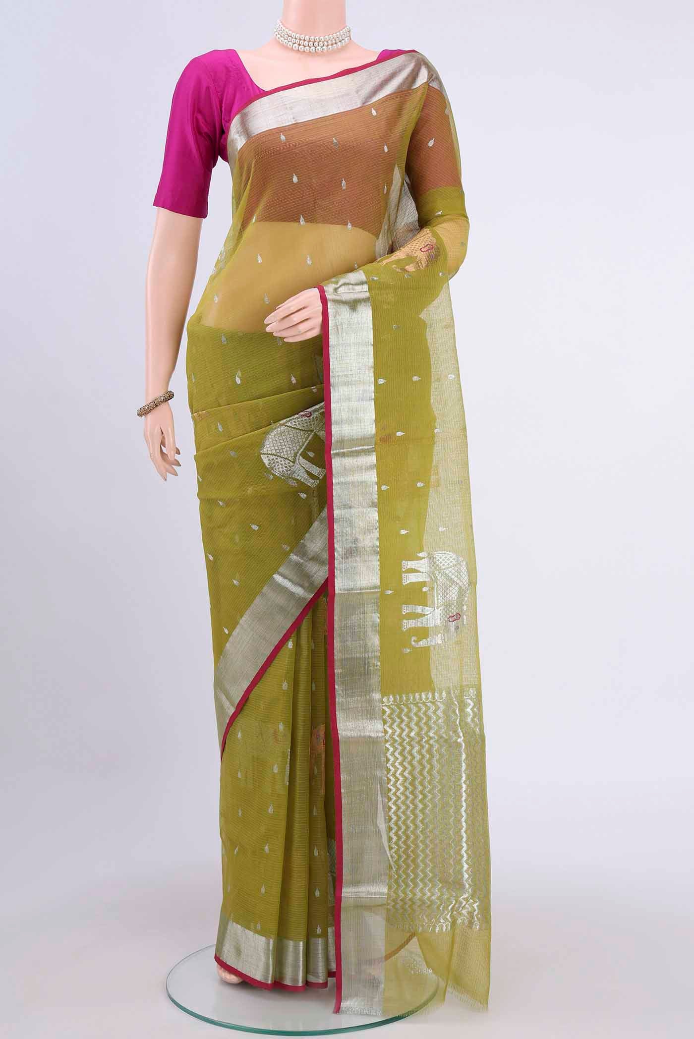 Pure Silk Pure Zari Mehandi Green Kota Saree with Zari And Thread Butta on the body and Zari Border displayed on a mannequin