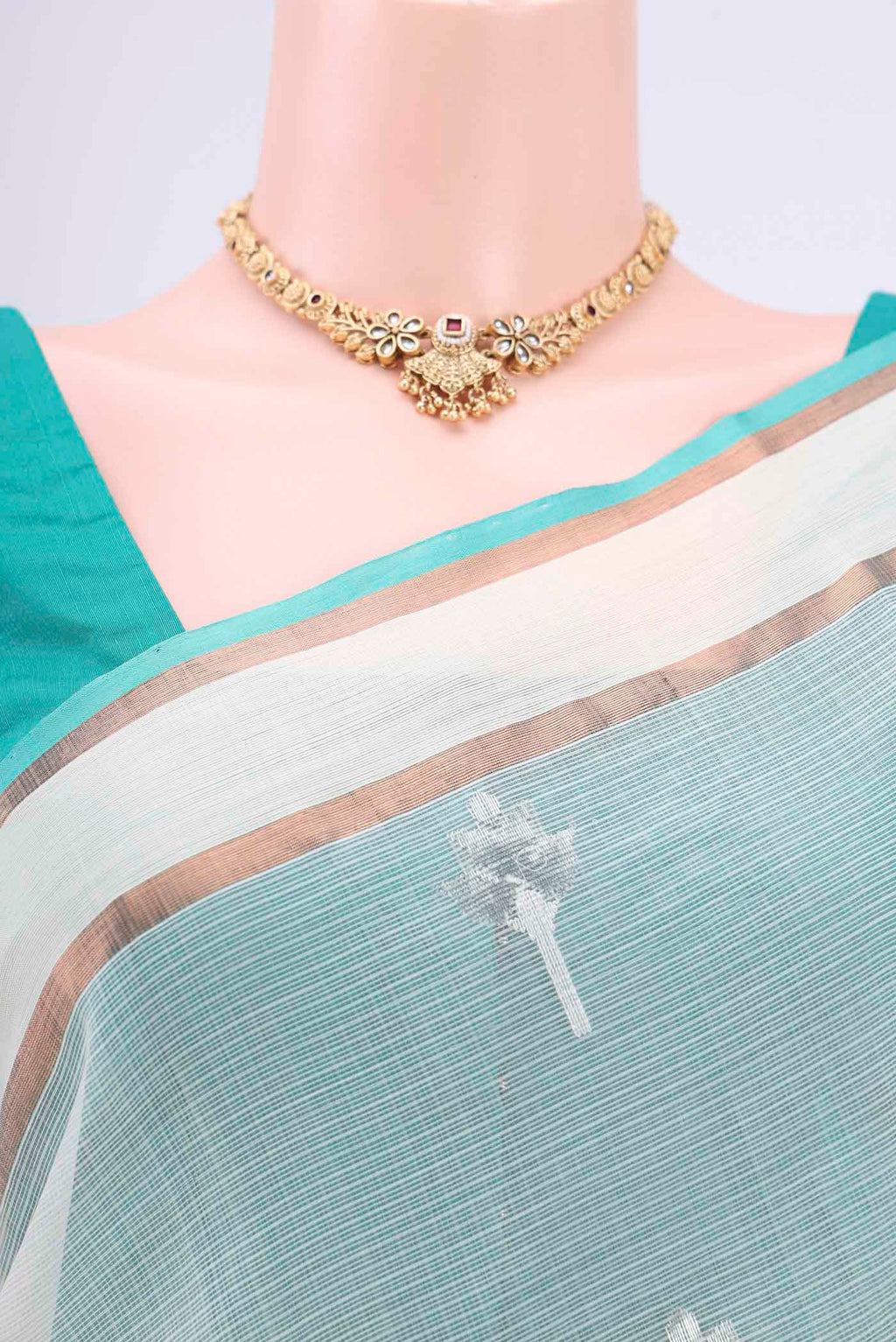 Border image of Pure Silk Pure Zari Mint Green Kota Cotton Saree with Zari And Thread Butta on the body and Zari Border. 