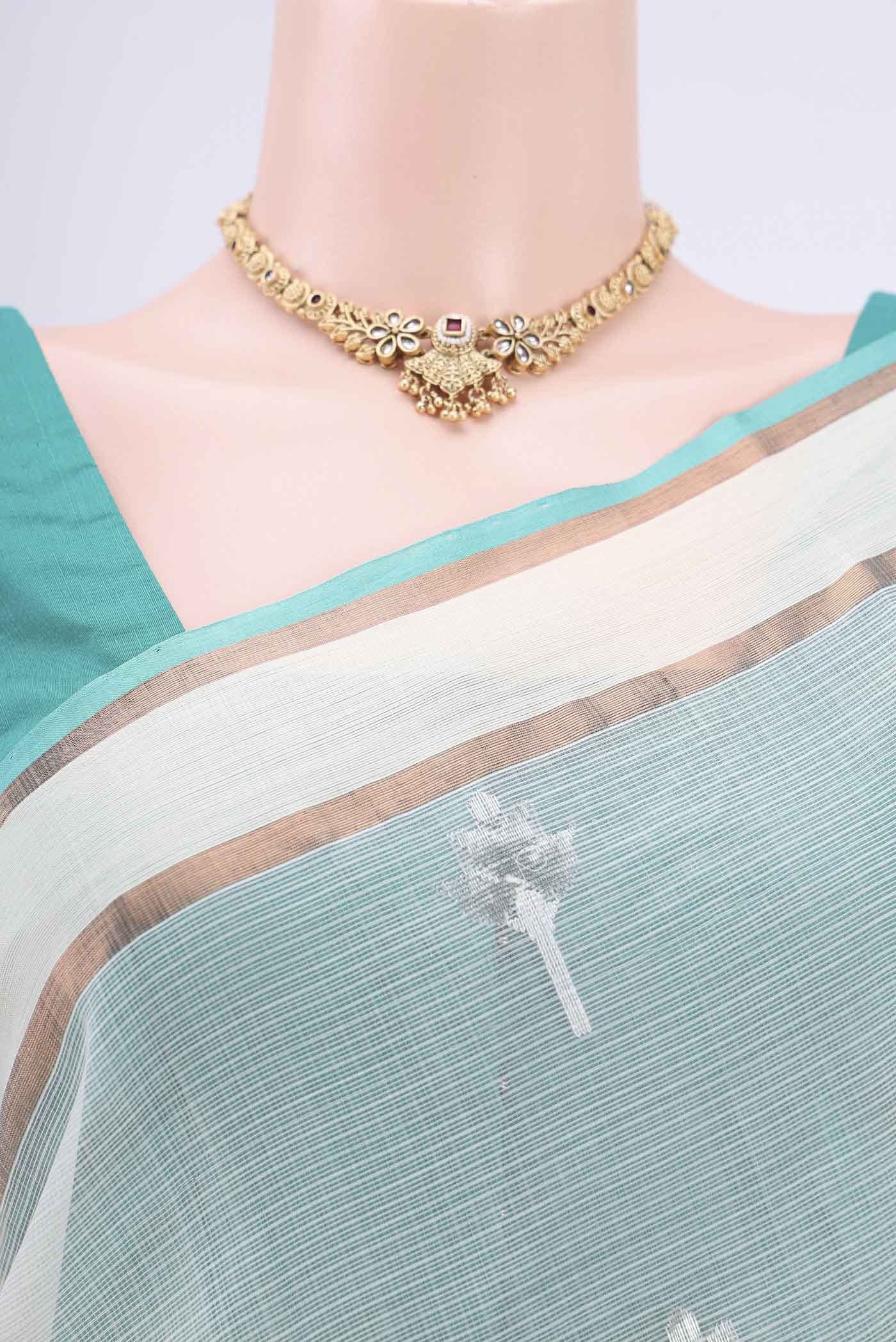 Border image of Pure Silk Pure Zari Mint Green Kota Cotton Saree with Zari And Thread Butta on the body and Zari Border. 